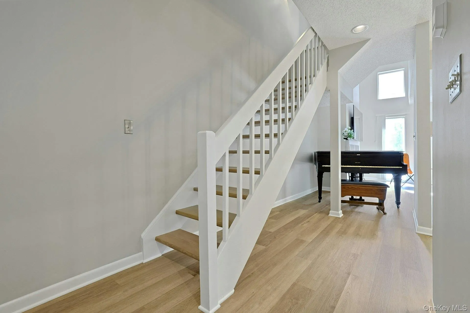 Inviting entryway with a beautiful staircase leading to the upper level. Inviting entryway with a beautiful staircase leading to the upper level.