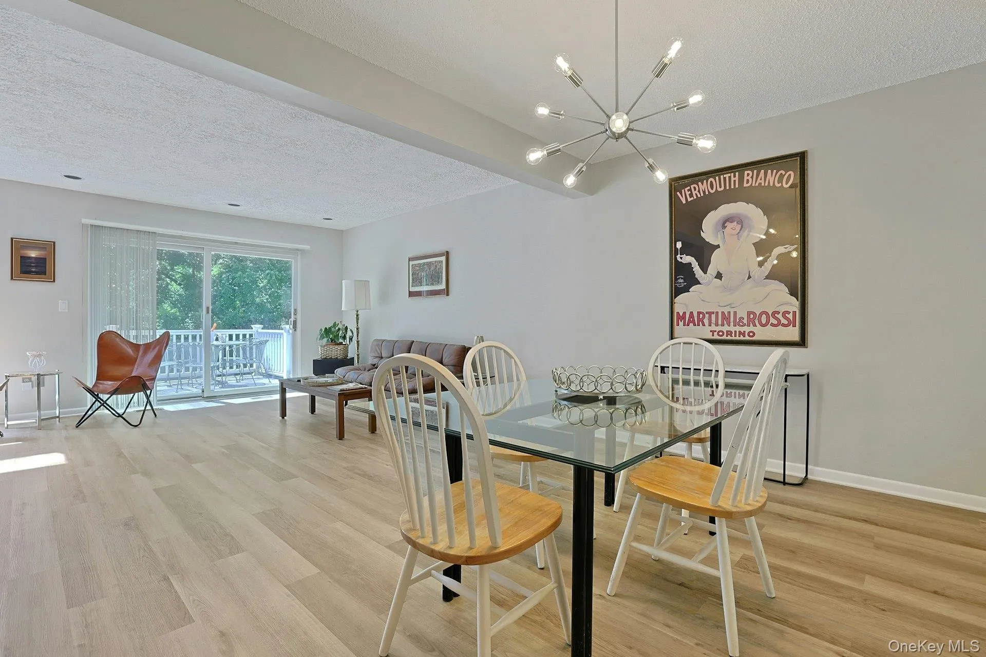 Dining area flows beautifully into the living room, creating an open and connected feel. Dining area flows beautifully into the living room, creating an open and connected feel.