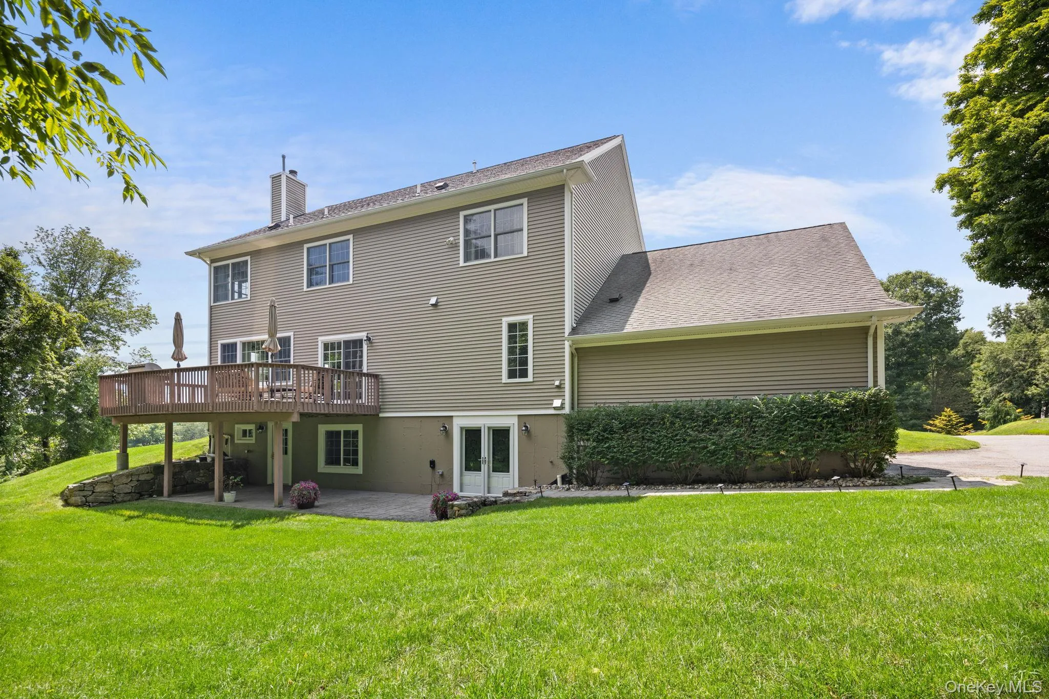 The thoughtfully designed lower level features two distinct living areas, each with its own private entrance and paved patio, offering abundant flexible space The thoughtfully designed lower level features two distinct living areas, each with its own private entrance and paved patio, offering abundant flexible space