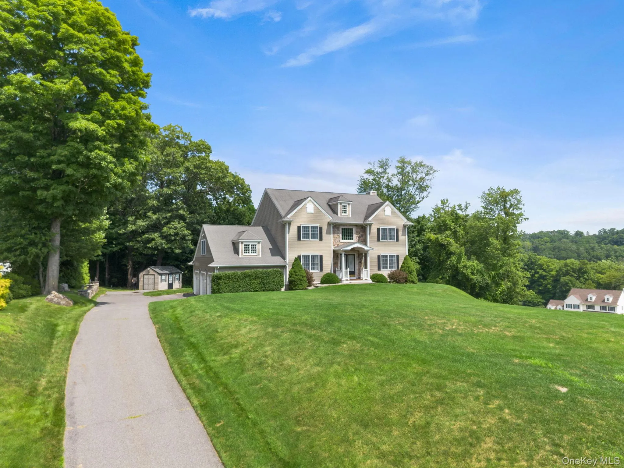 Lush, verdant lawns surround the property, complemented by an oversized driveway and a storage shed with electricity—offering both beauty and everyday functionality. Lush, verdant lawns surround the property, complemented by an oversized driveway and a storage shed with electricity—offering both beauty and everyday functionality.