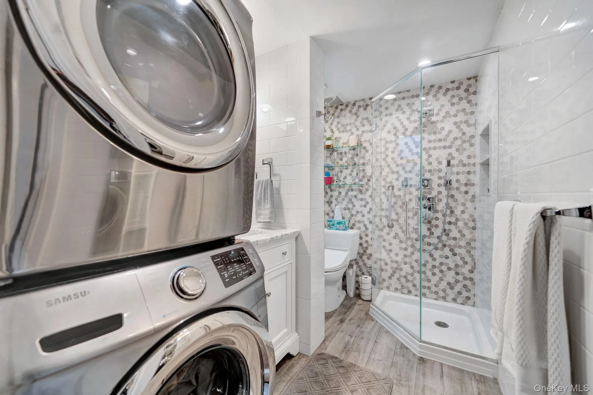 First floor bath featuring washer dryer First floor bath featuring washer dryer