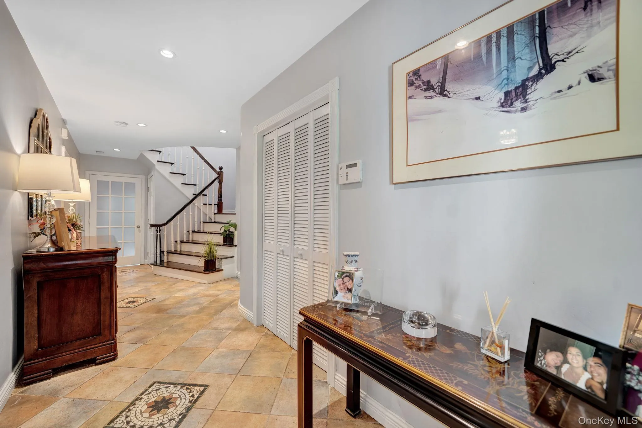 Entry foyer featuring coat closet Entry foyer featuring coat closet