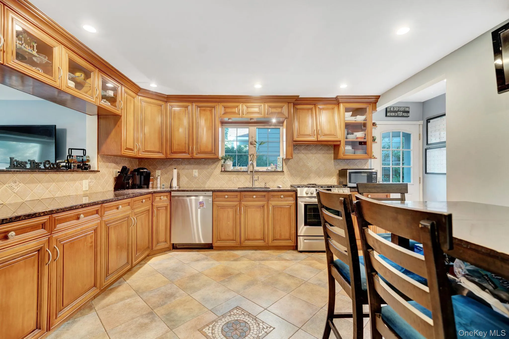 Eat-in kitchen featuring granite countertops Eat-in kitchen featuring granite countertops