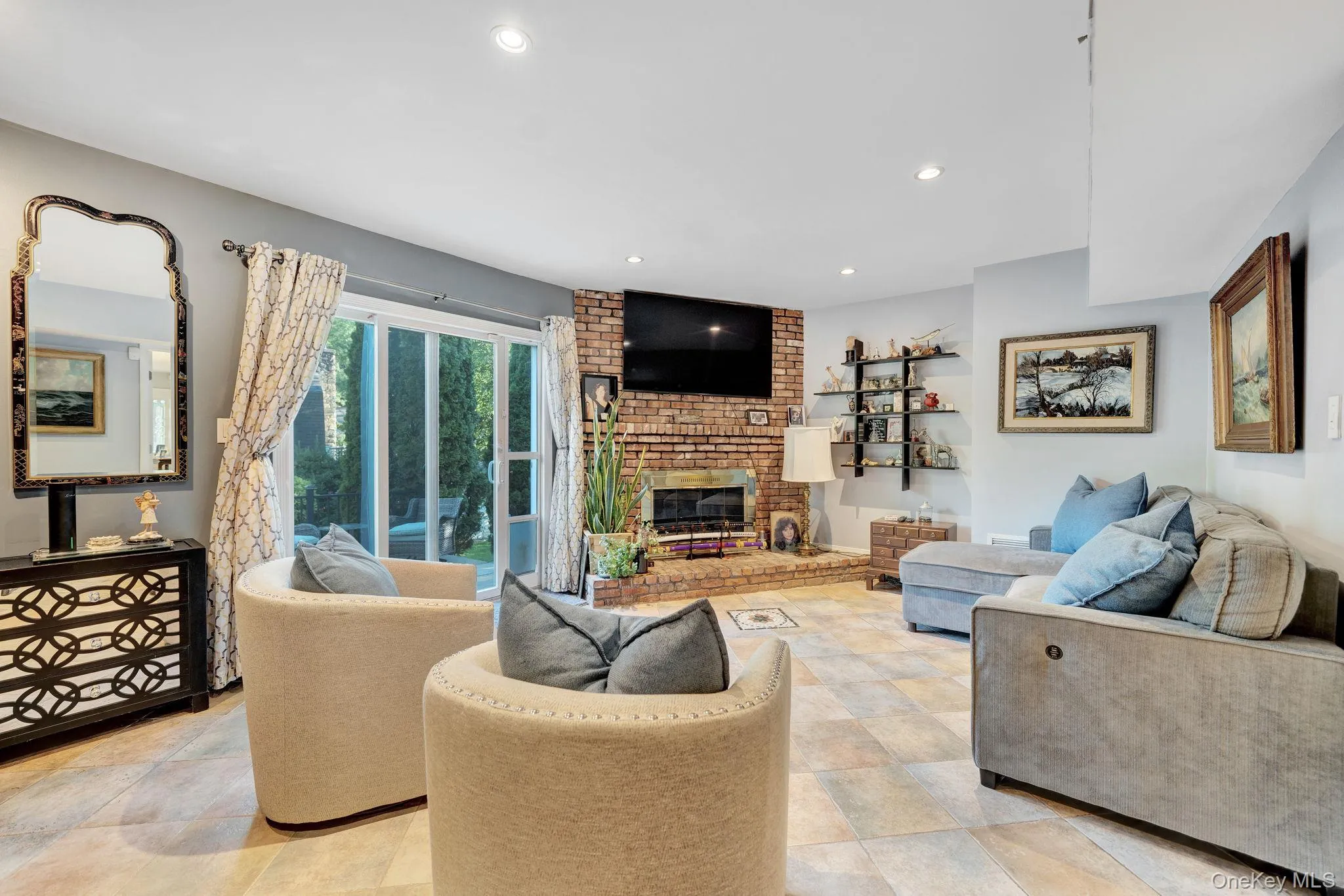 Family room/den featuring sliding doors and wood burning fireplace Family room/den featuring sliding doors and wood burning fireplace