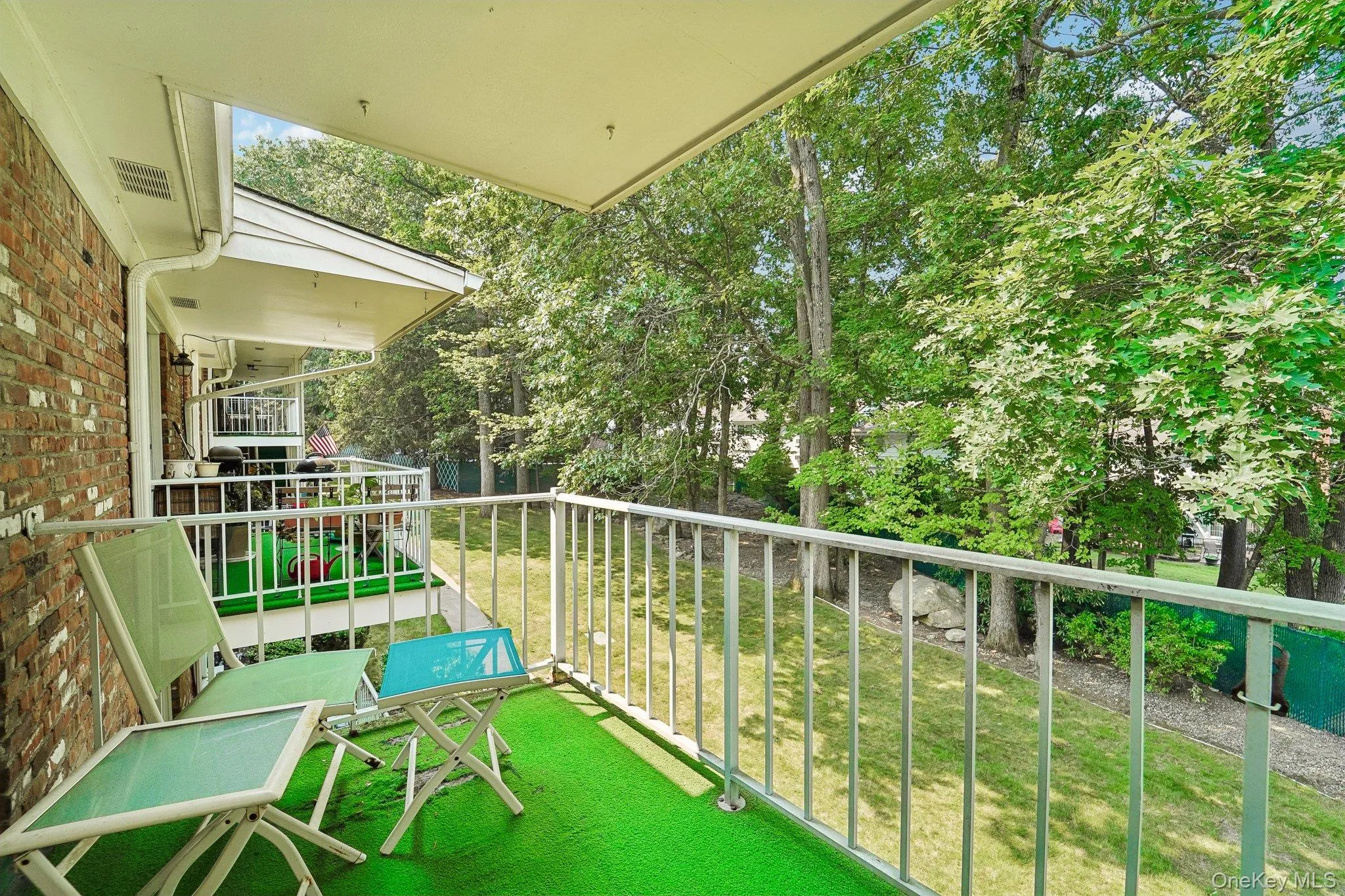 Personal deck with pretty overlook to tree-lined, professionally landscaped lawn. Personal deck with pretty overlook to tree-lined, professionally landscaped lawn.