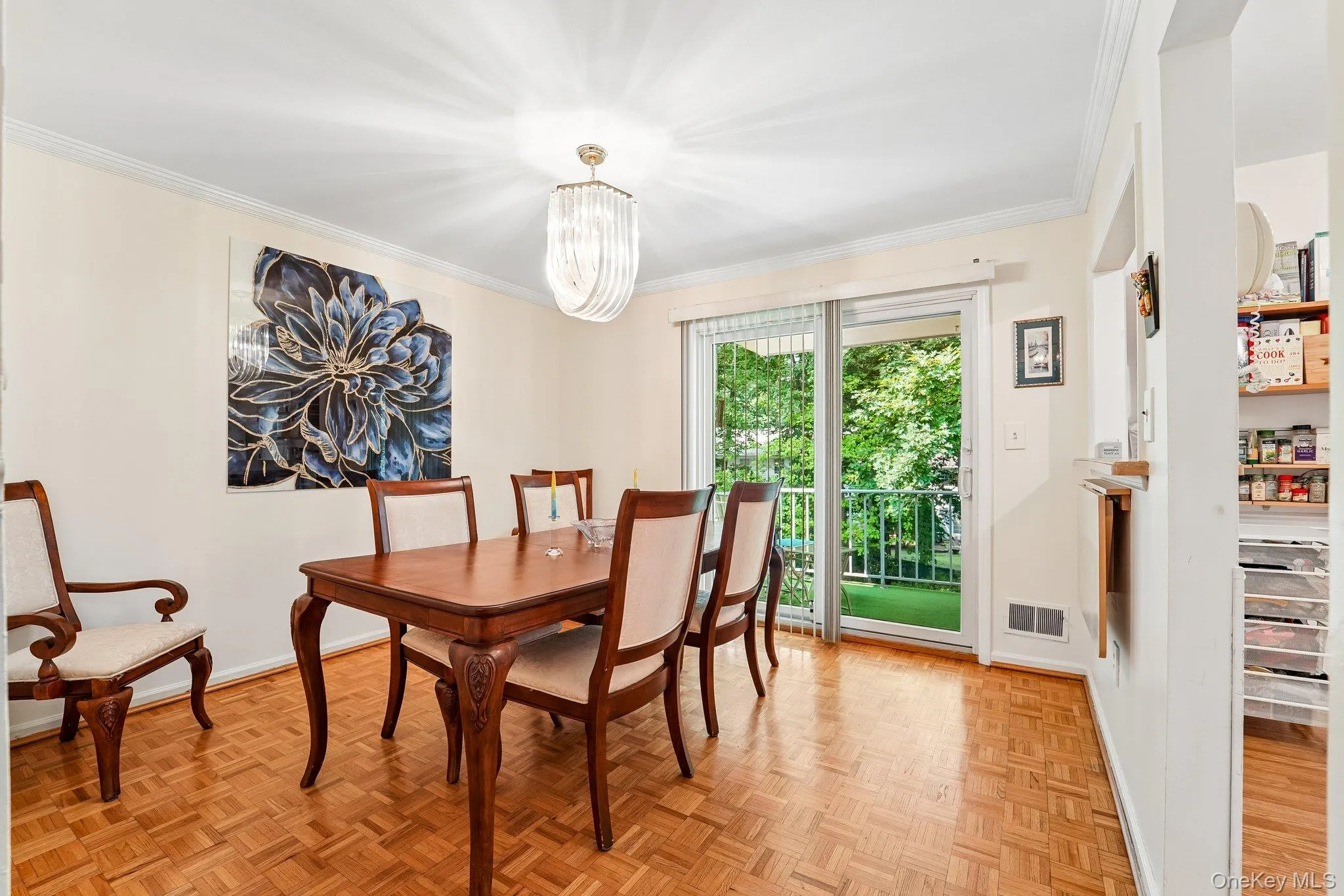 Open plan with parquet flooring, stylish ceiling light, neutral paint, sliders to the private deck, and a "pass-thru" to the kitchen. Open plan with parquet flooring, stylish ceiling light, neutral paint, sliders to the private deck, and a "pass-thru" to the kitchen.