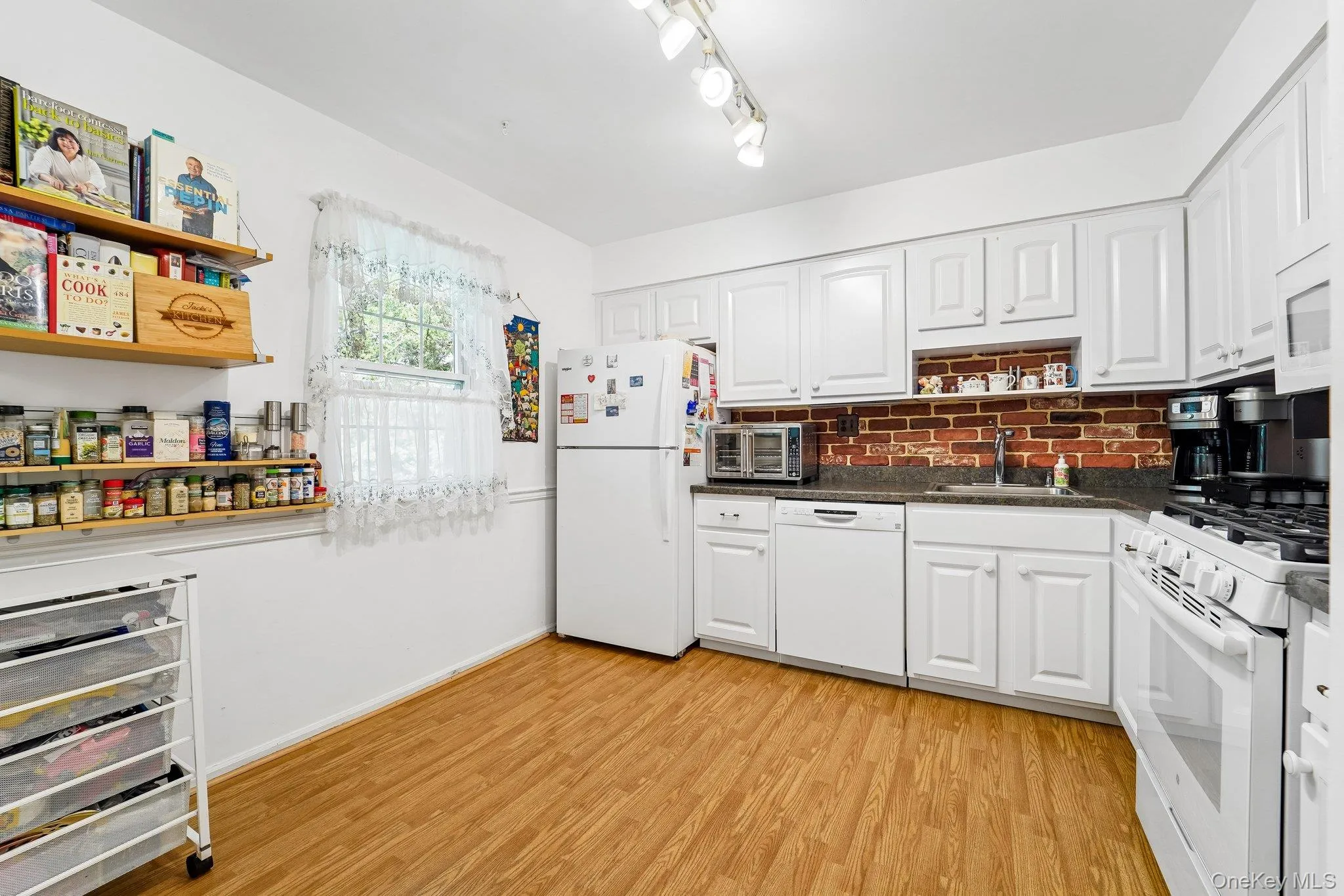 Brightly updated kitchen with cabinets galore, a pantry (not visible in this picture) and room for a table. Brightly updated kitchen with cabinets galore, a pantry (not visible in this picture) and room for a table.