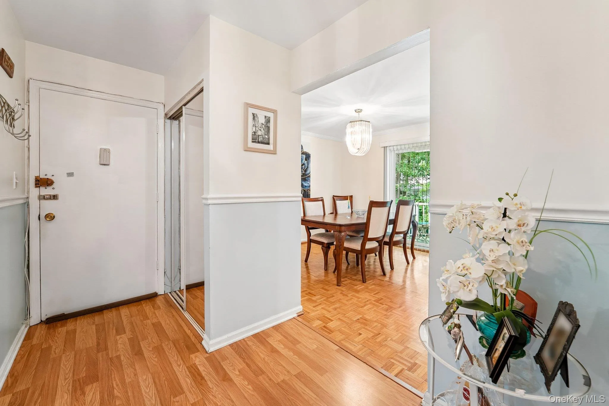 View to the unit entry door, and another double-closet with mirrored sliders. View to the unit entry door, and another double-closet with mirrored sliders.