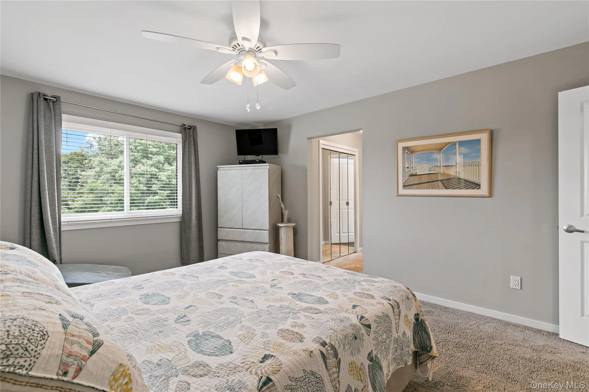 Primary bedroom with walk-in closet and updated bathroom. Primary bedroom with walk-in closet and updated bathroom.