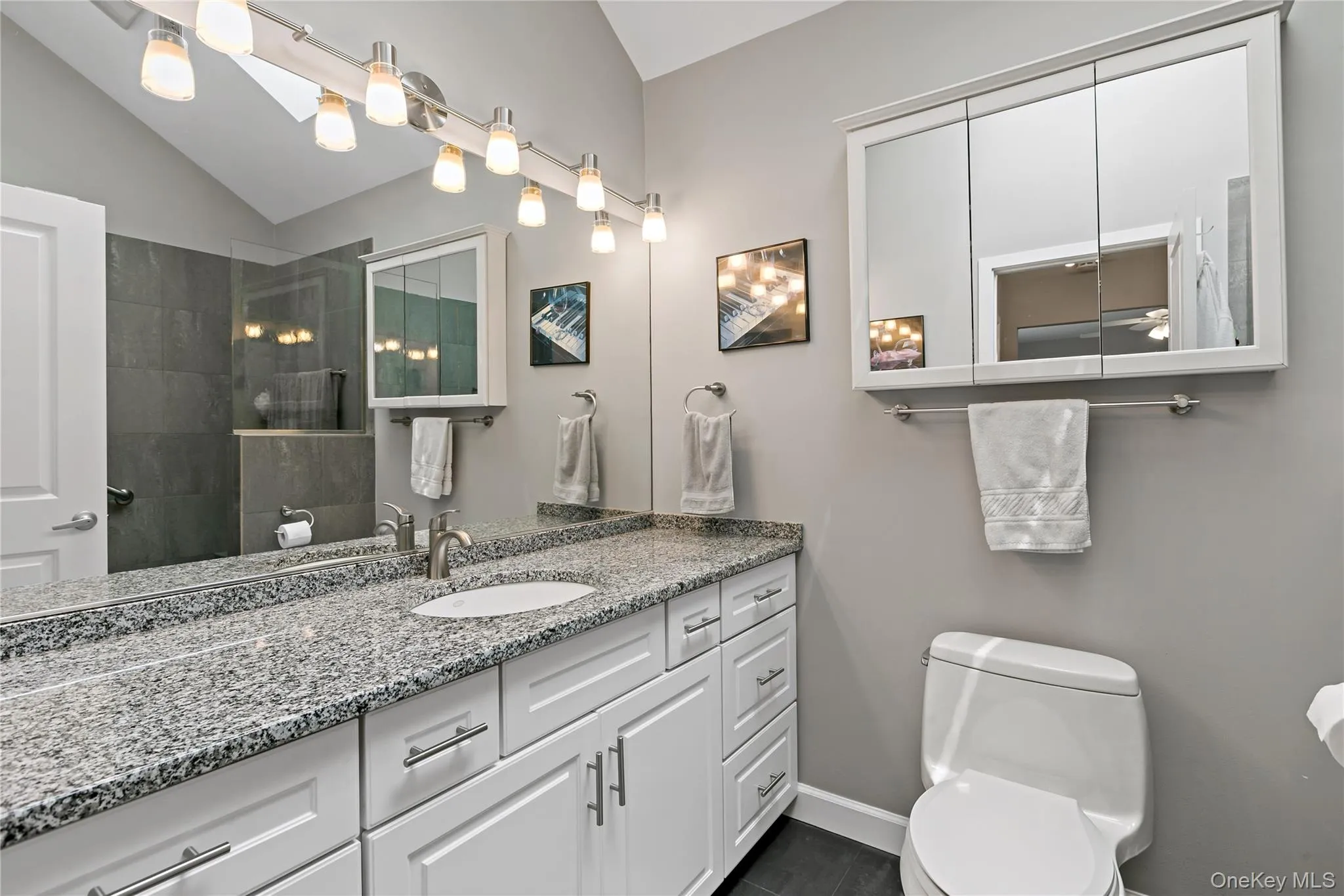 Remodeled bathrooms with soft-close toilet seats (2007).Heated floor in primary bathroom (2007).New bathroom faucet (2025).New oversized walk-in shower. Remodeled bathrooms with soft-close toilet seats (2007).Heated floor in primary bathroom (2007).New bathroom faucet (2025).New oversized walk-in shower.