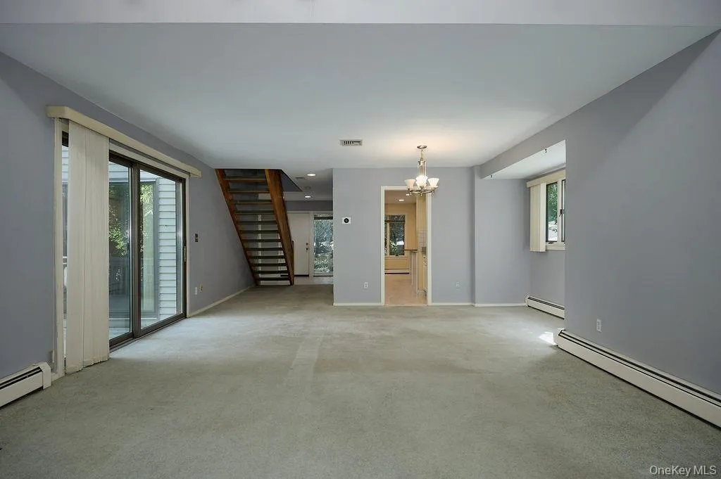 View from the far end of the Living Room out to the front entrance View from the far end of the Living Room out to the front entrance