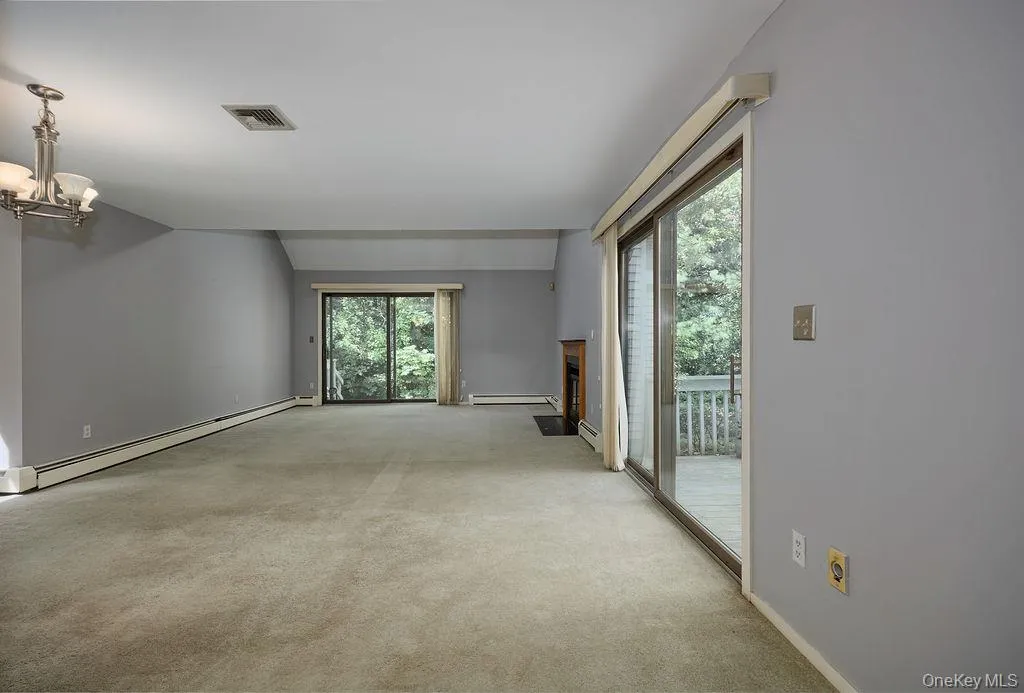 Spacious Living Room with SGD to two decks Spacious Living Room with SGD to two decks