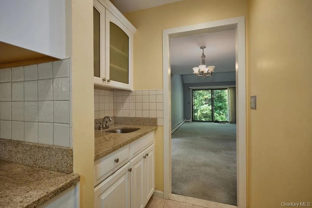 Separate area with a small sink and storage could be used as a bar area Separate area with a small sink and storage could be used as a bar area