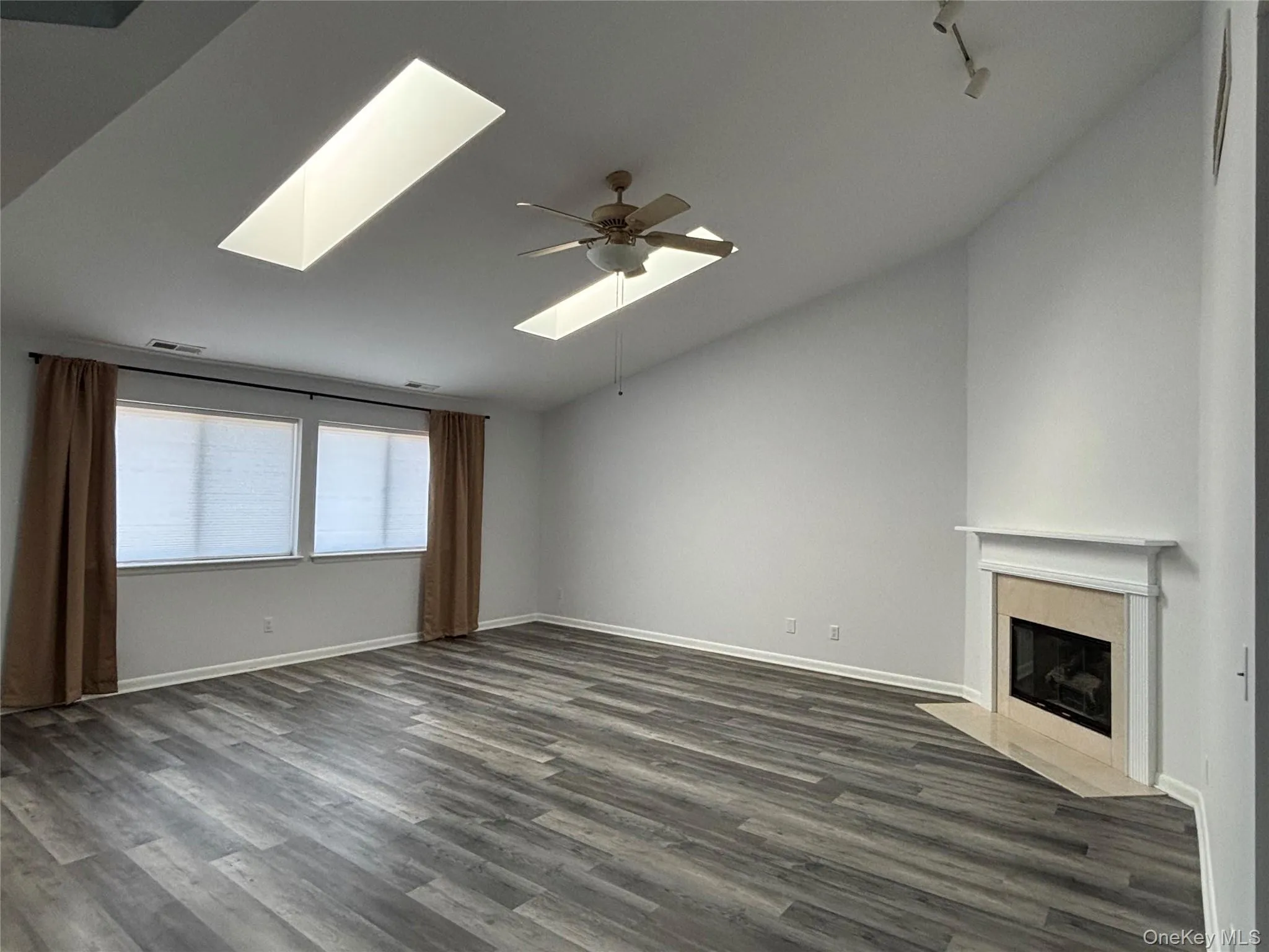Bright with vaulted ceiling, skylights and fireplace Bright with vaulted ceiling, skylights and fireplace