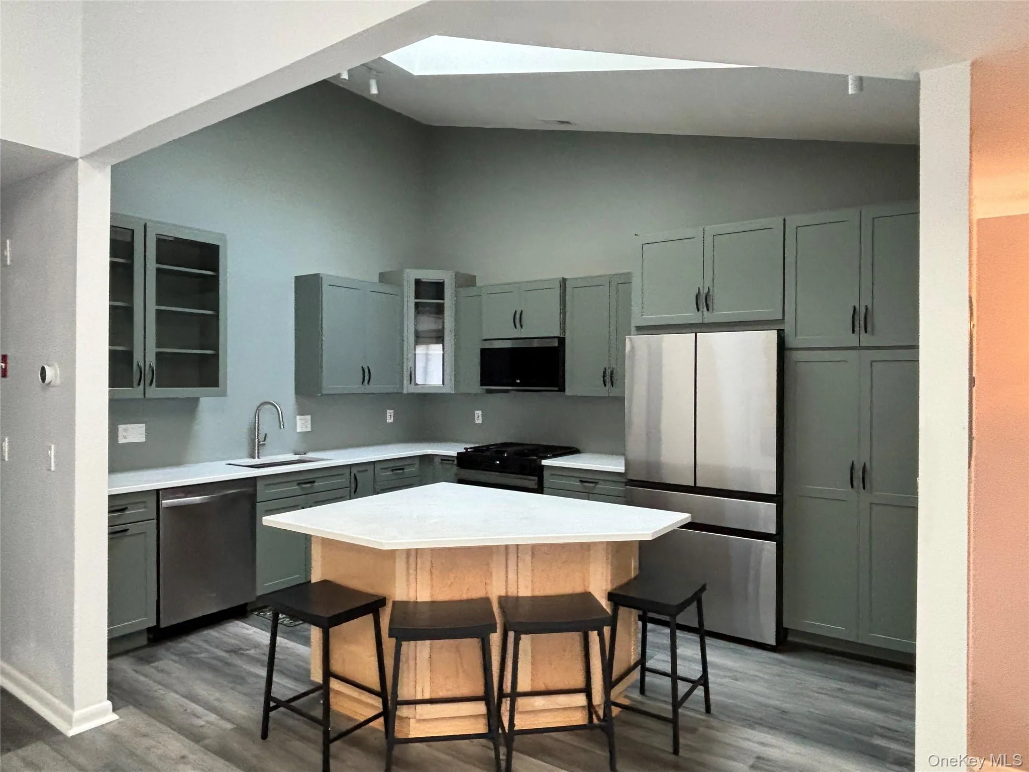 Skylights, vaulted ceiling and island Skylights, vaulted ceiling and island