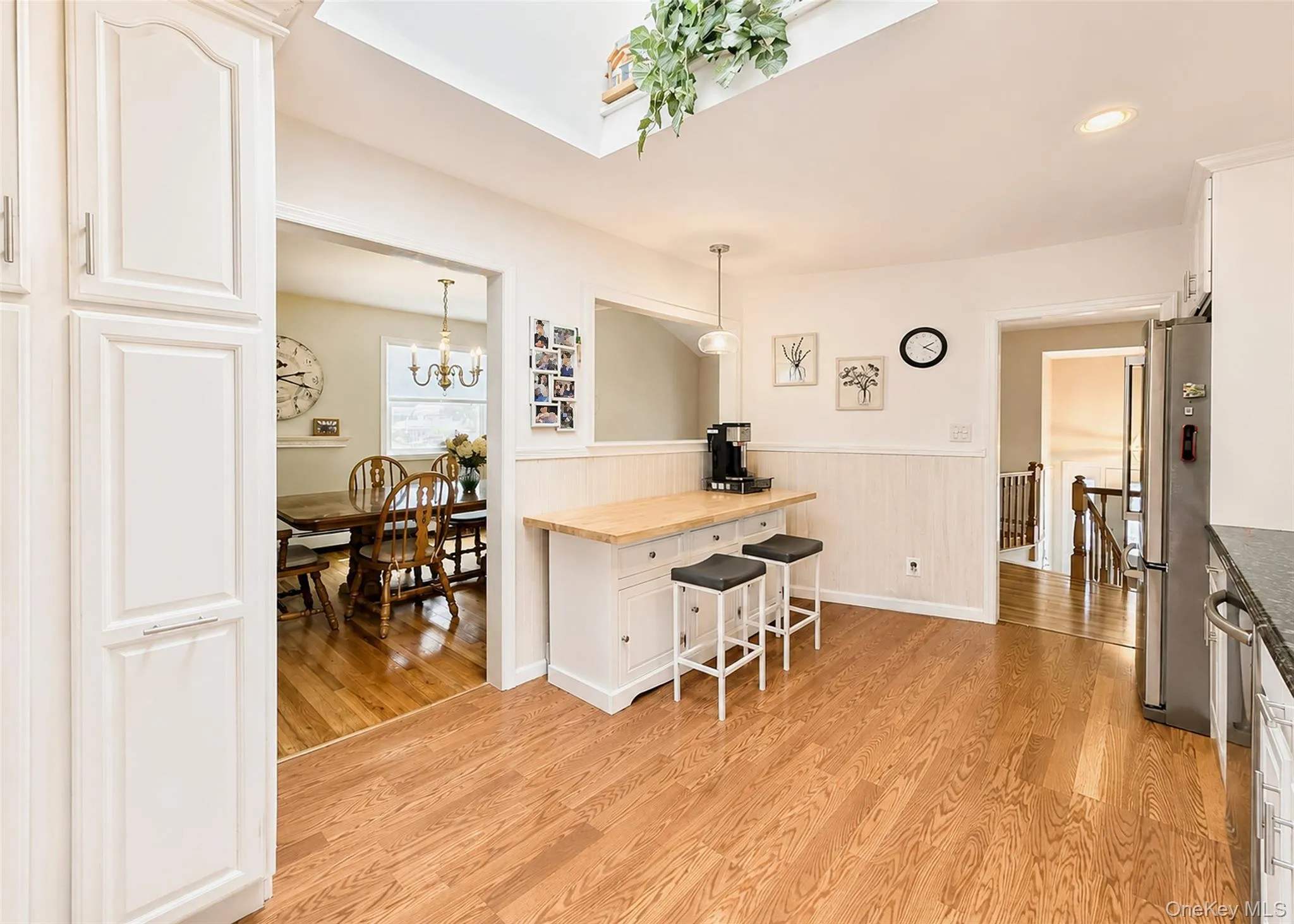 Wainscotting, Hi-Hats, & Wood-Like Laminate Flooring. Wainscotting, Hi-Hats, & Wood-Like Laminate Flooring.