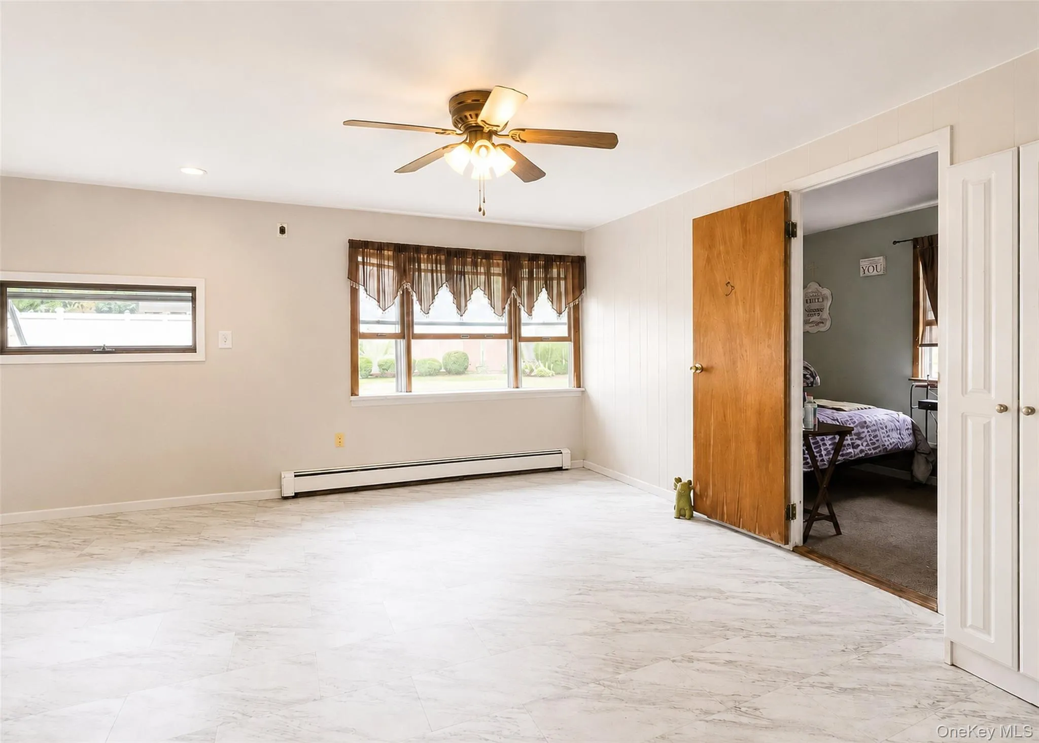 Lower Level - Recreation Area With Bay Window, Hi-Hats, & Tile Flooring. Lower Level - Recreation Area With Bay Window, Hi-Hats, & Tile Flooring.