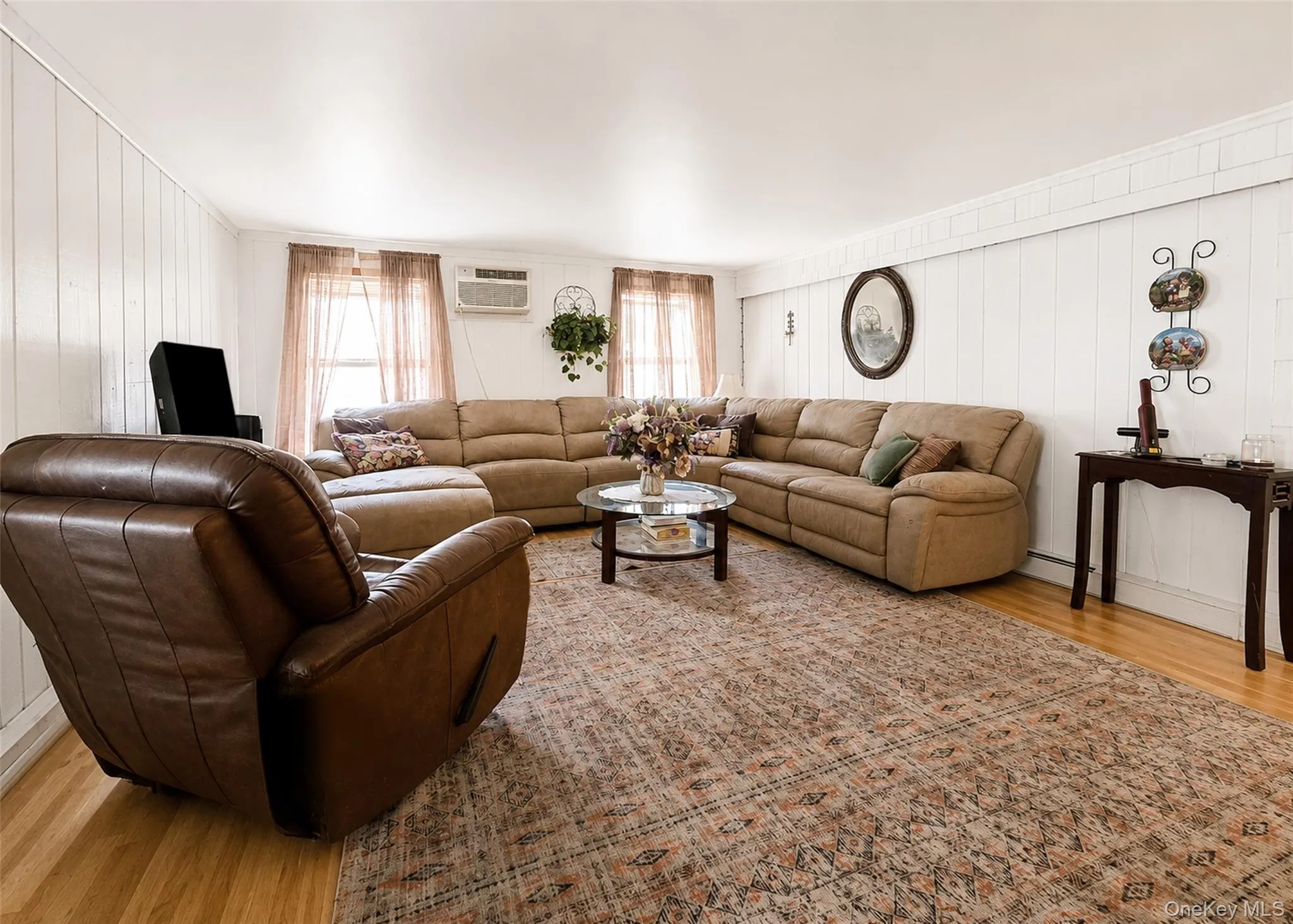 Lower Level - Large Den With Crown Molding & Wood-Like Laminate Flooring. Lower Level - Large Den With Crown Molding & Wood-Like Laminate Flooring.