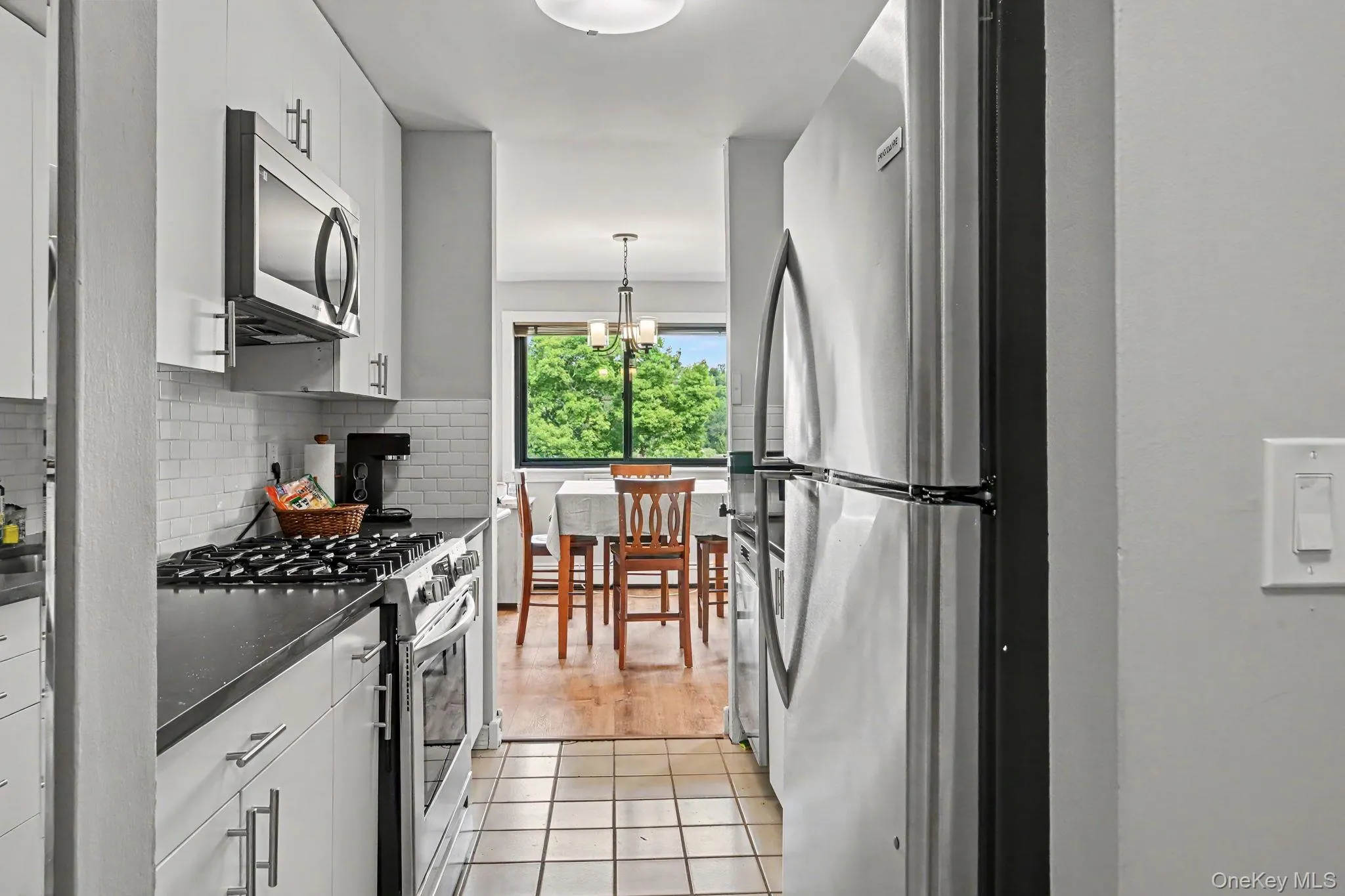 Kitchen with view of Dining Area. Kitchen with view of Dining Area.