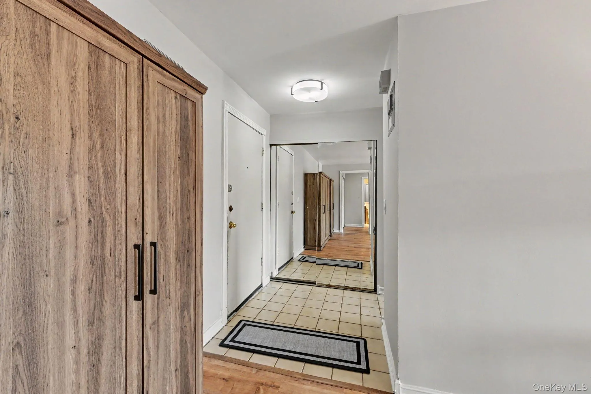 Hallway with closet on the left. Hallway with closet on the left.
