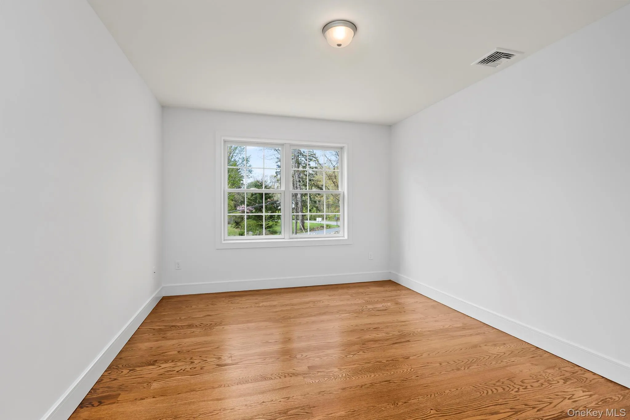 One of the additional bedrooms with hardwood floor One of the additional bedrooms with hardwood floor