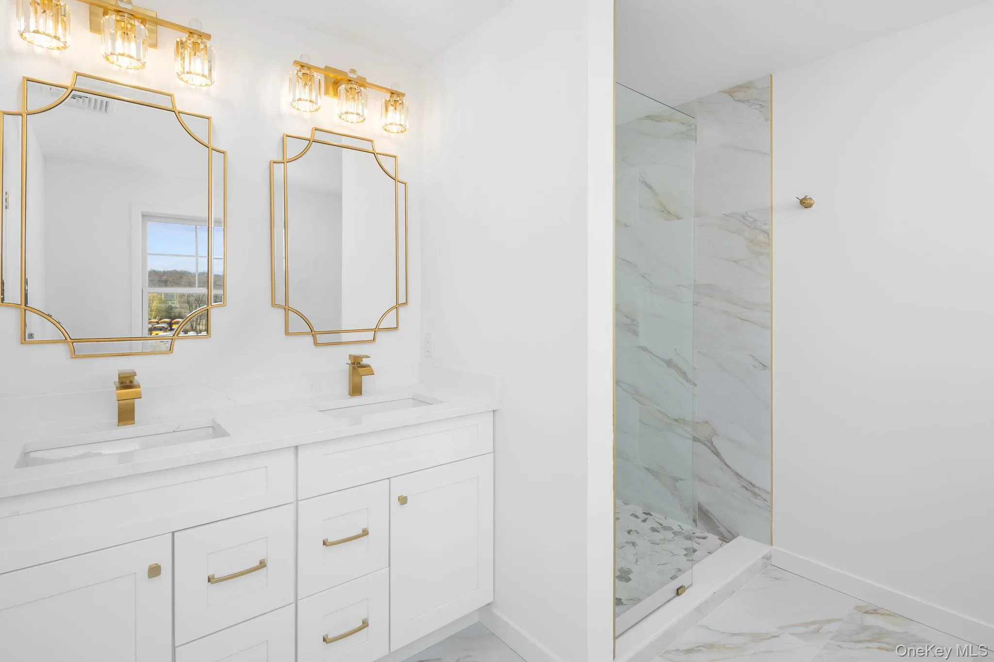 This custom design bathroom in a previously built home with gold color accented tiling and accessories. All subject to change This custom design bathroom in a previously built home with gold color accented tiling and accessories. All subject to change