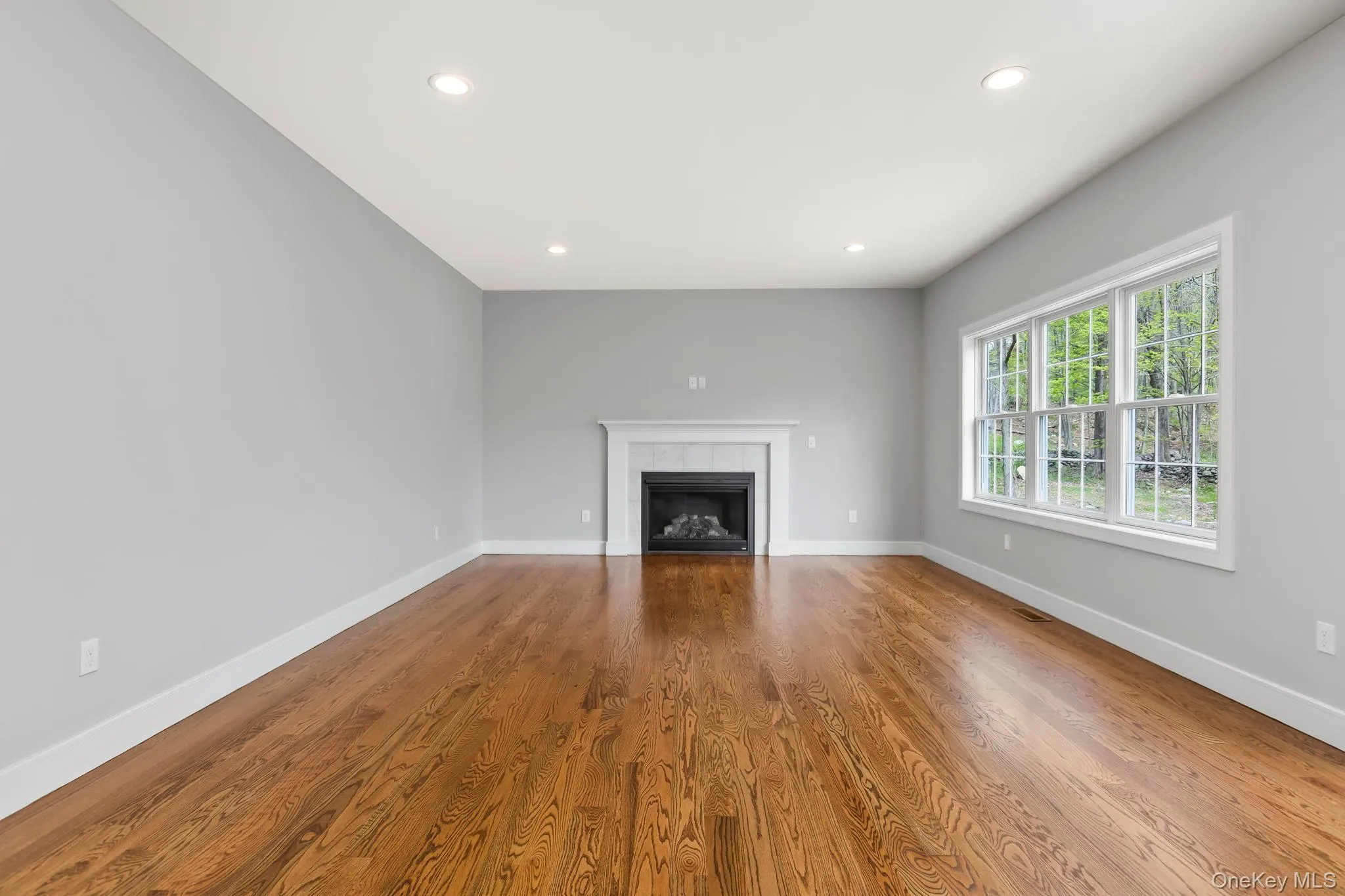 Family room will include hardwood floor, gas fireplace and recessed lighting, and high ceiling; some of the features showed in this previously built home's photo. All subject to change Family room will include hardwood floor, gas fireplace and recessed lighting, and high ceiling; some of the features showed in this previously built home's photo. All subject to change