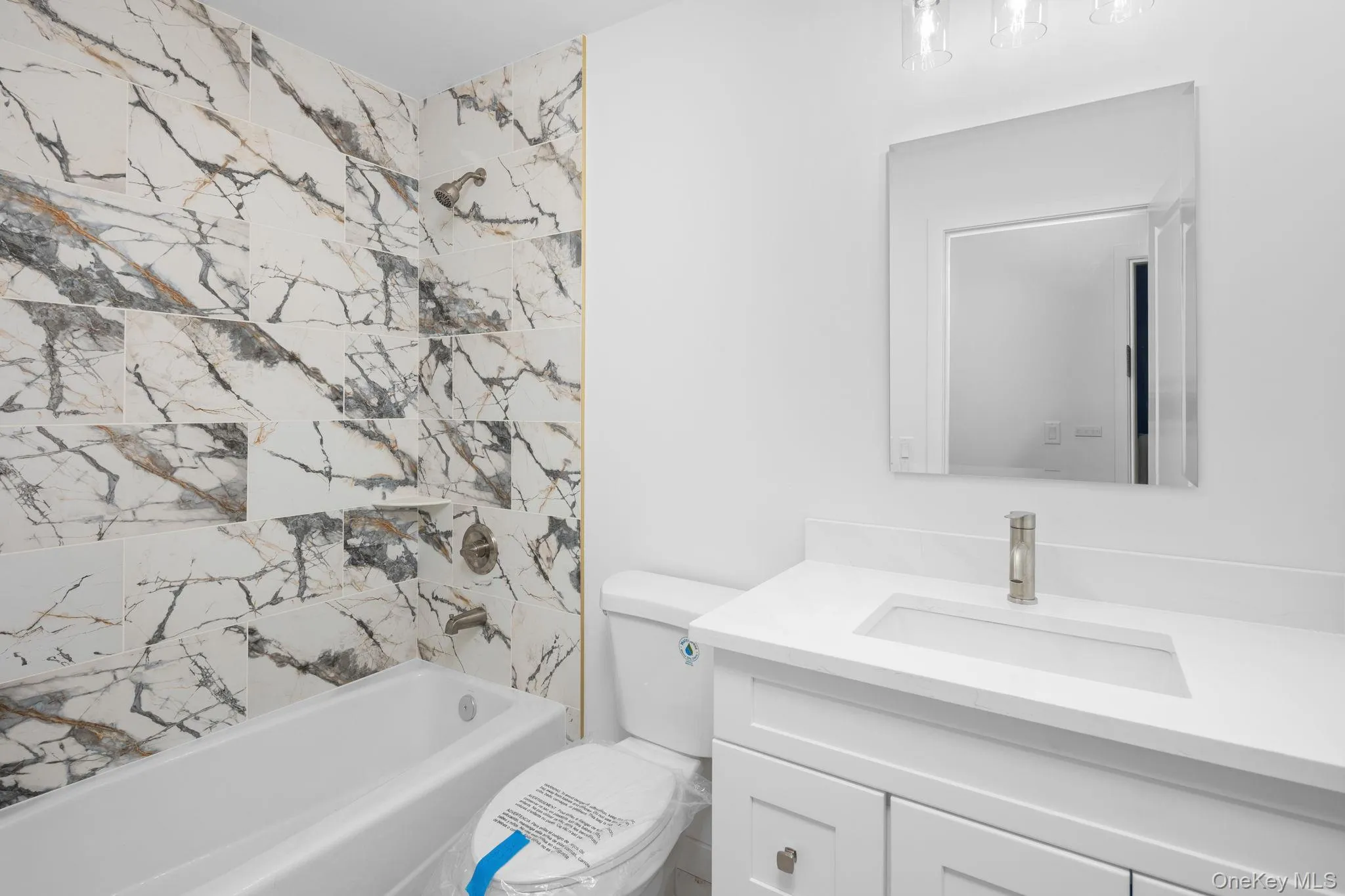 Depicting one of the hall baths with tiled shower/tub combo and vanity that was featured in another home built by the same buildersAll subject to change Depicting one of the hall baths with tiled shower/tub combo and vanity that was featured in another home built by the same buildersAll subject to change