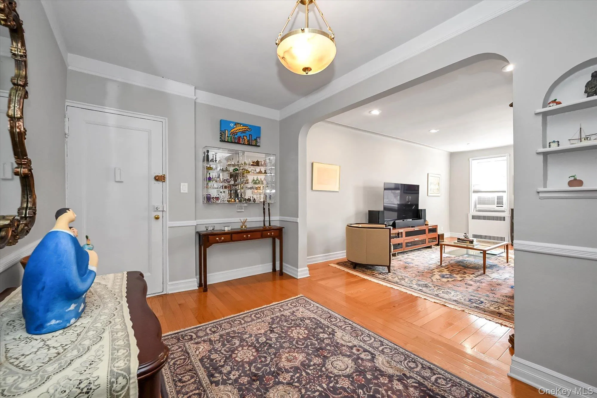 This entrance Foyer couples as a dining room, flowing naturally into the living room for entertaining This entrance Foyer couples as a dining room, flowing naturally into the living room for entertaining