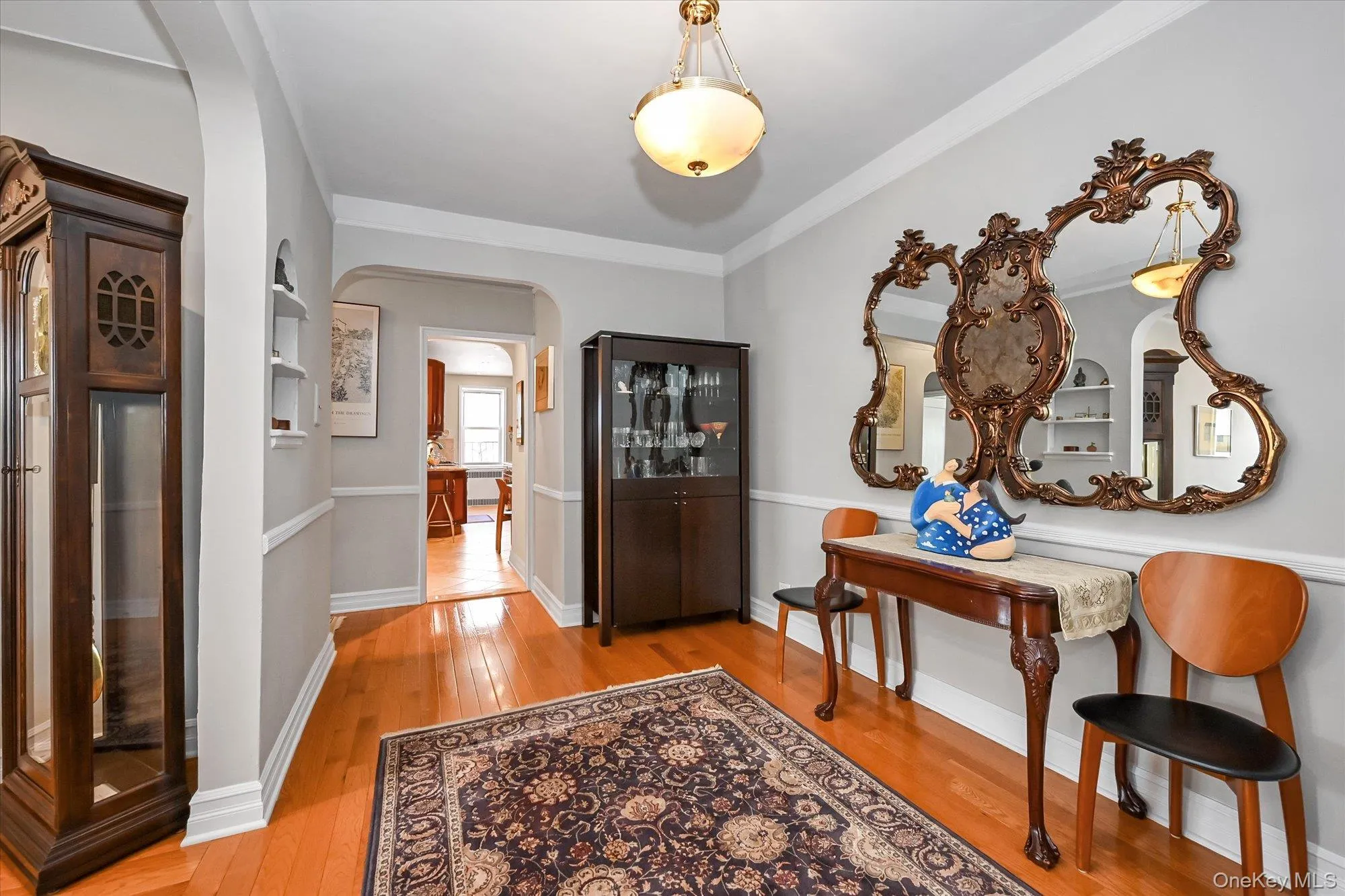 Another view of the foyer. with renovated hardwood floors Another view of the foyer. with renovated hardwood floors