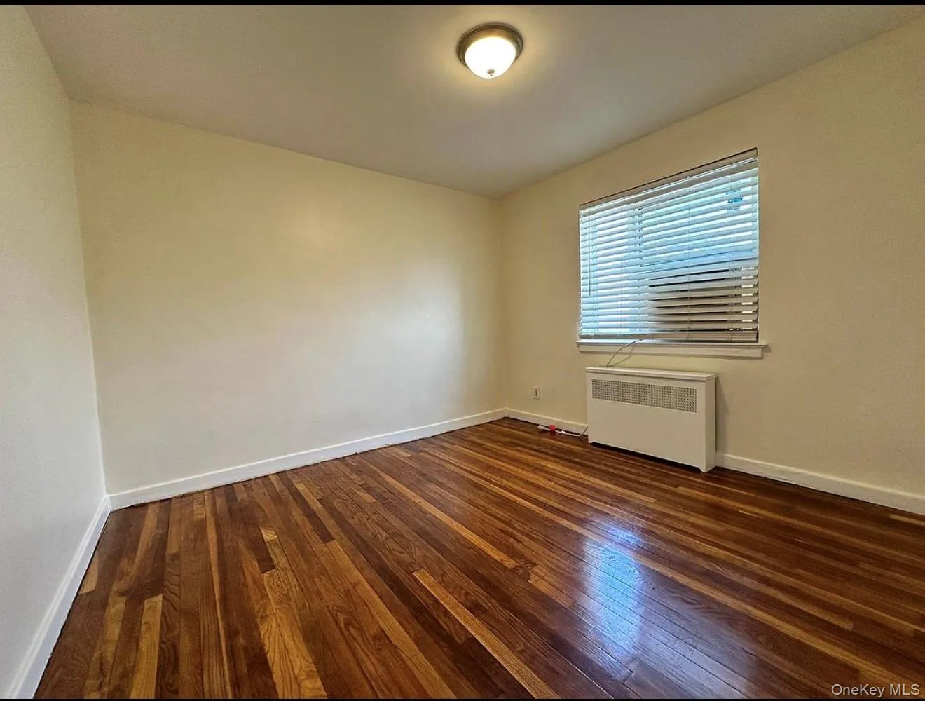 Refinished wood flooring complements the neutral wall tones Refinished wood flooring complements the neutral wall tones