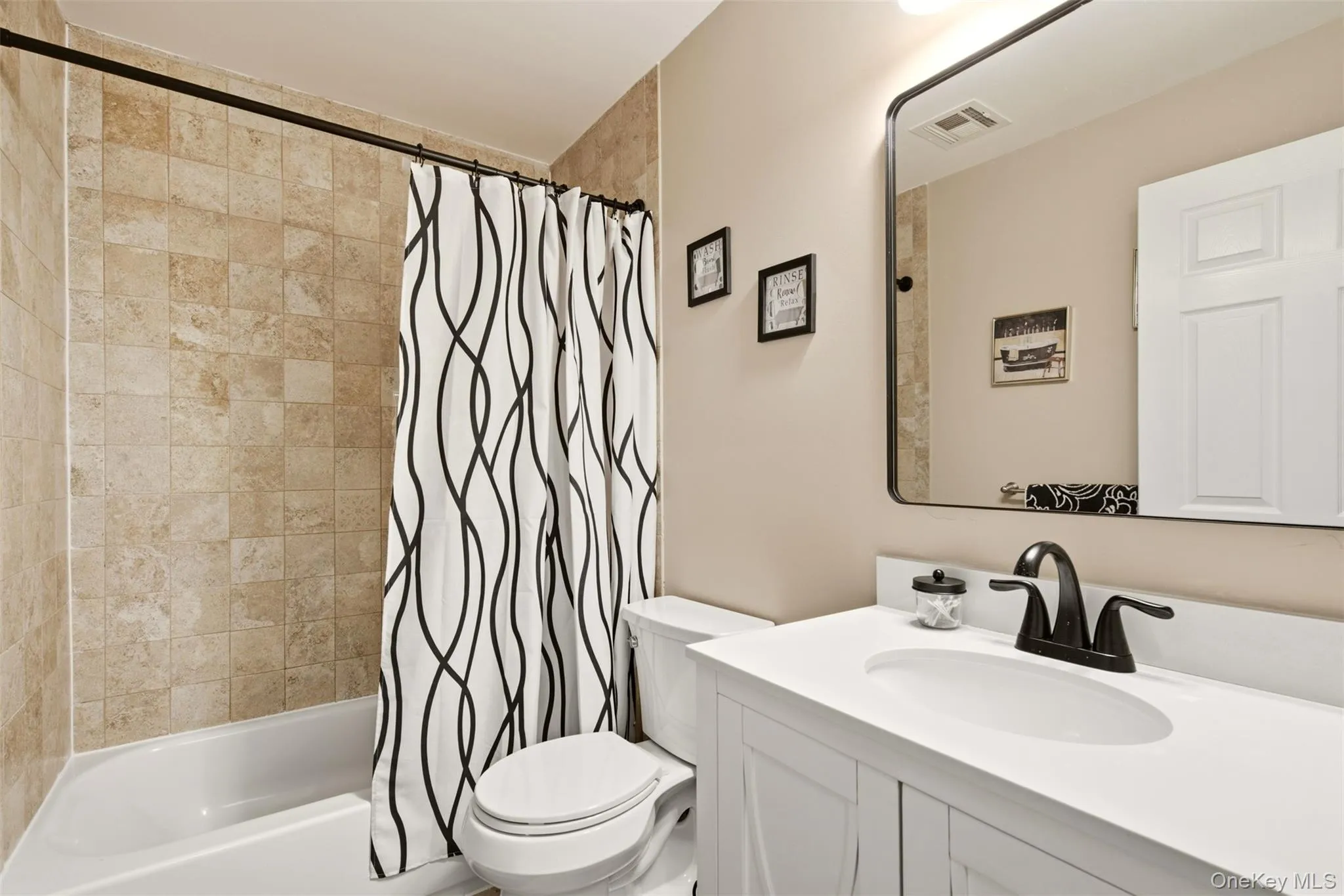 Second floor family bathroom fully tiled with updated fixtures Second floor family bathroom fully tiled with updated fixtures