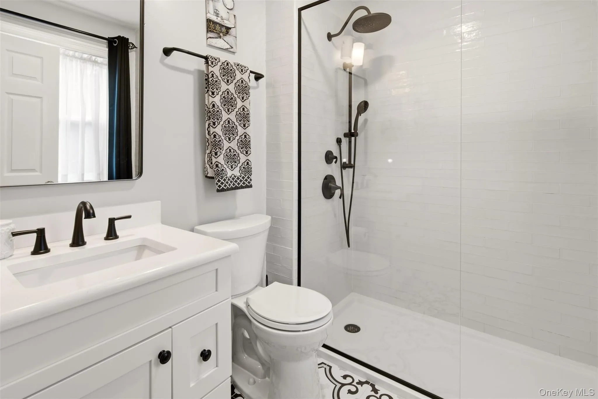 Updated primary bath with spacious walk in shower Updated primary bath with spacious walk in shower