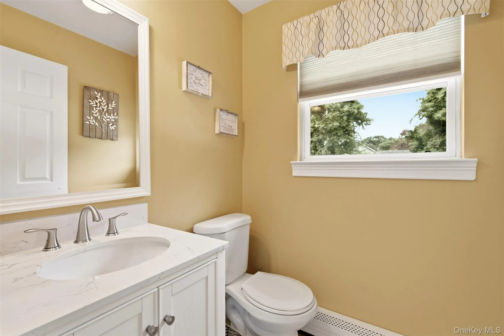Updated powder room off side door to yard Updated powder room off side door to yard