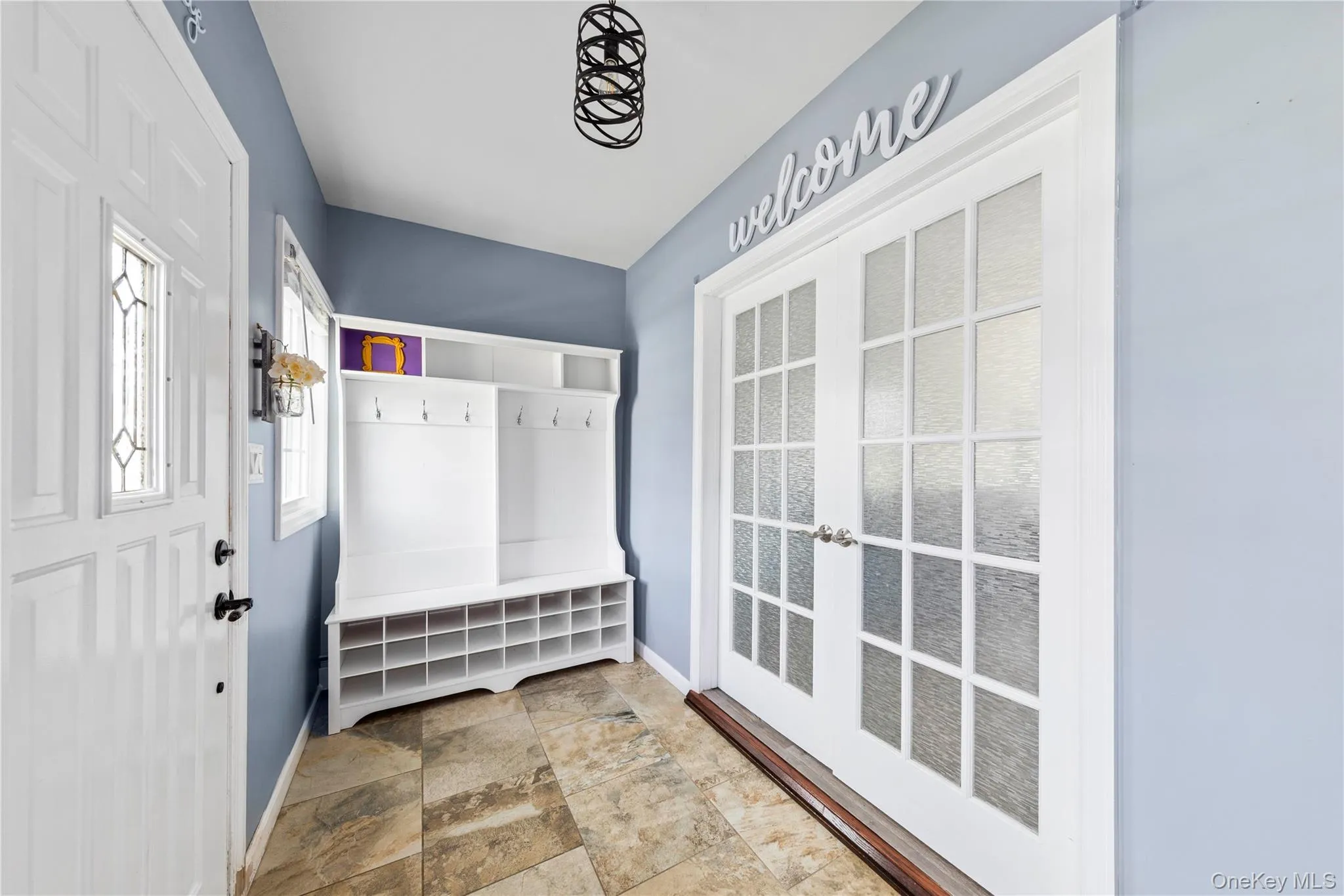 Foyer / Mudroom featuring a white French door -Bonus ! Foyer / Mudroom featuring a white French door -Bonus !