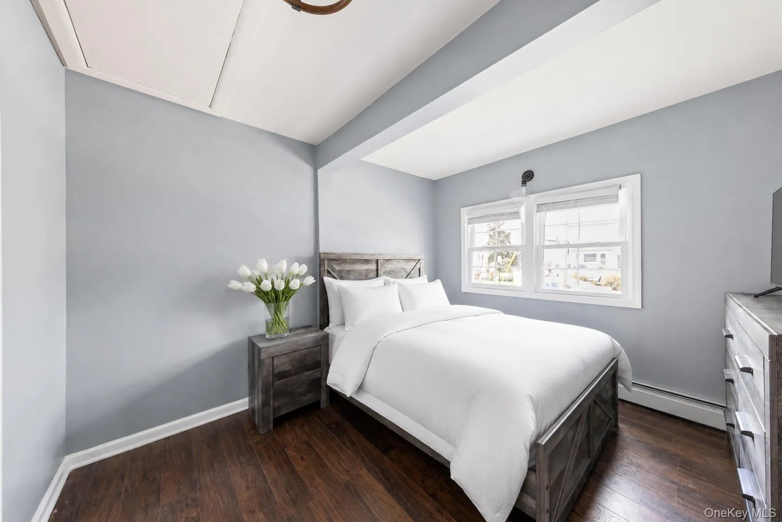 Hardwood-style flooring look throughout this room with light blue walls Hardwood-style flooring look throughout this room with light blue walls