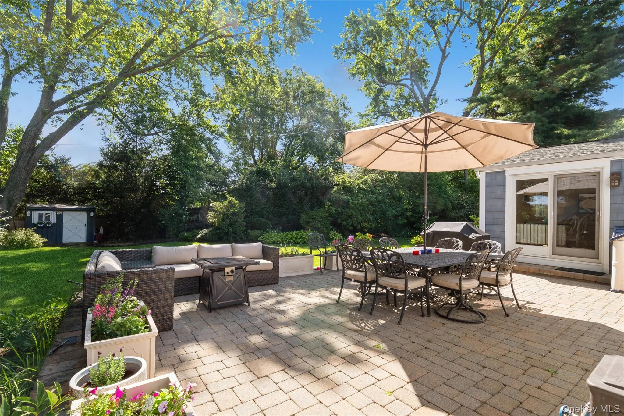 The spacious paver patio extends living space outdoors. The spacious paver patio extends living space outdoors.