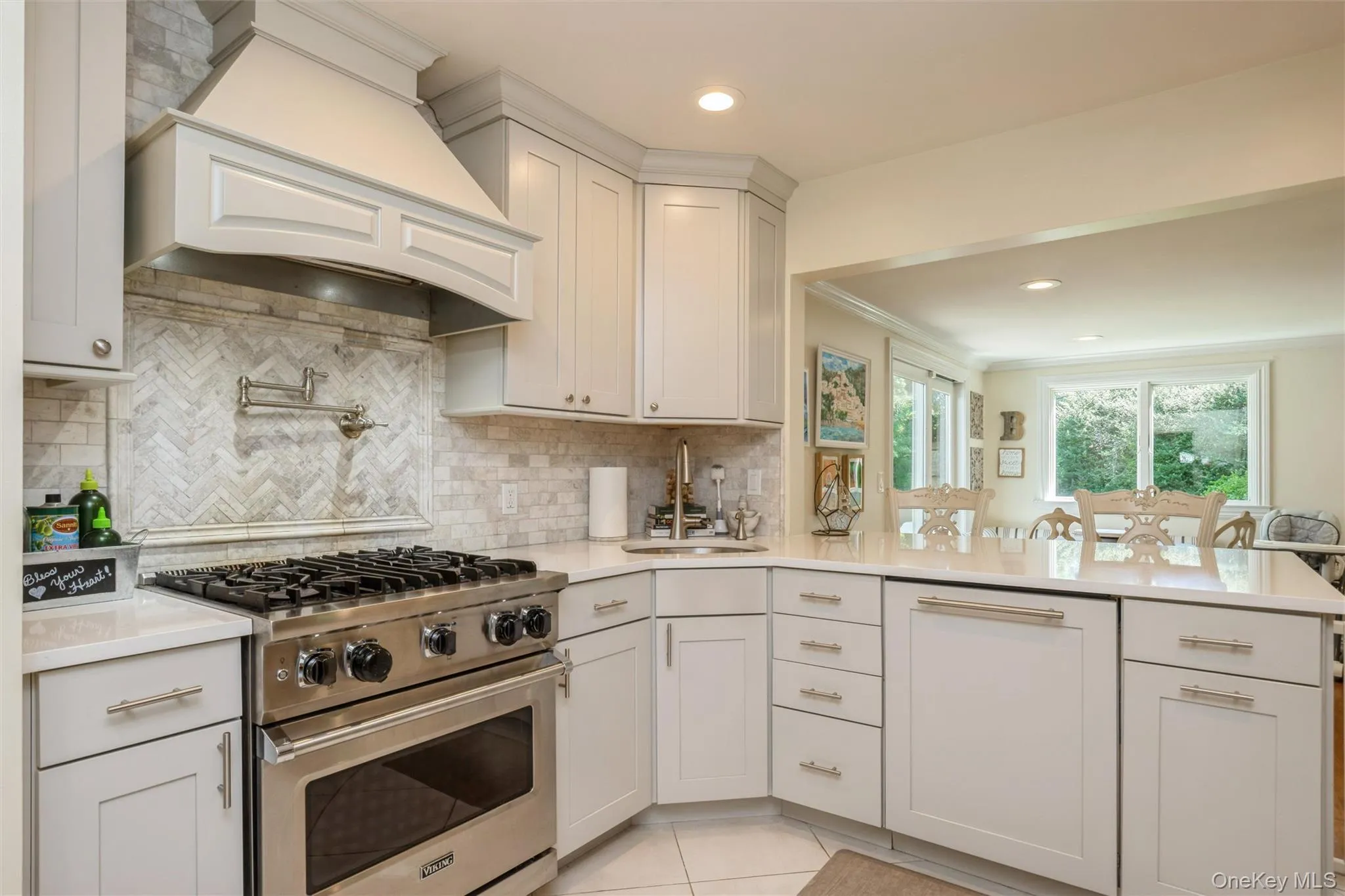 Custom cabinetry, sleek quartz countertops, professional grade appliances define this culinary space. Custom cabinetry, sleek quartz countertops, professional grade appliances define this culinary space.