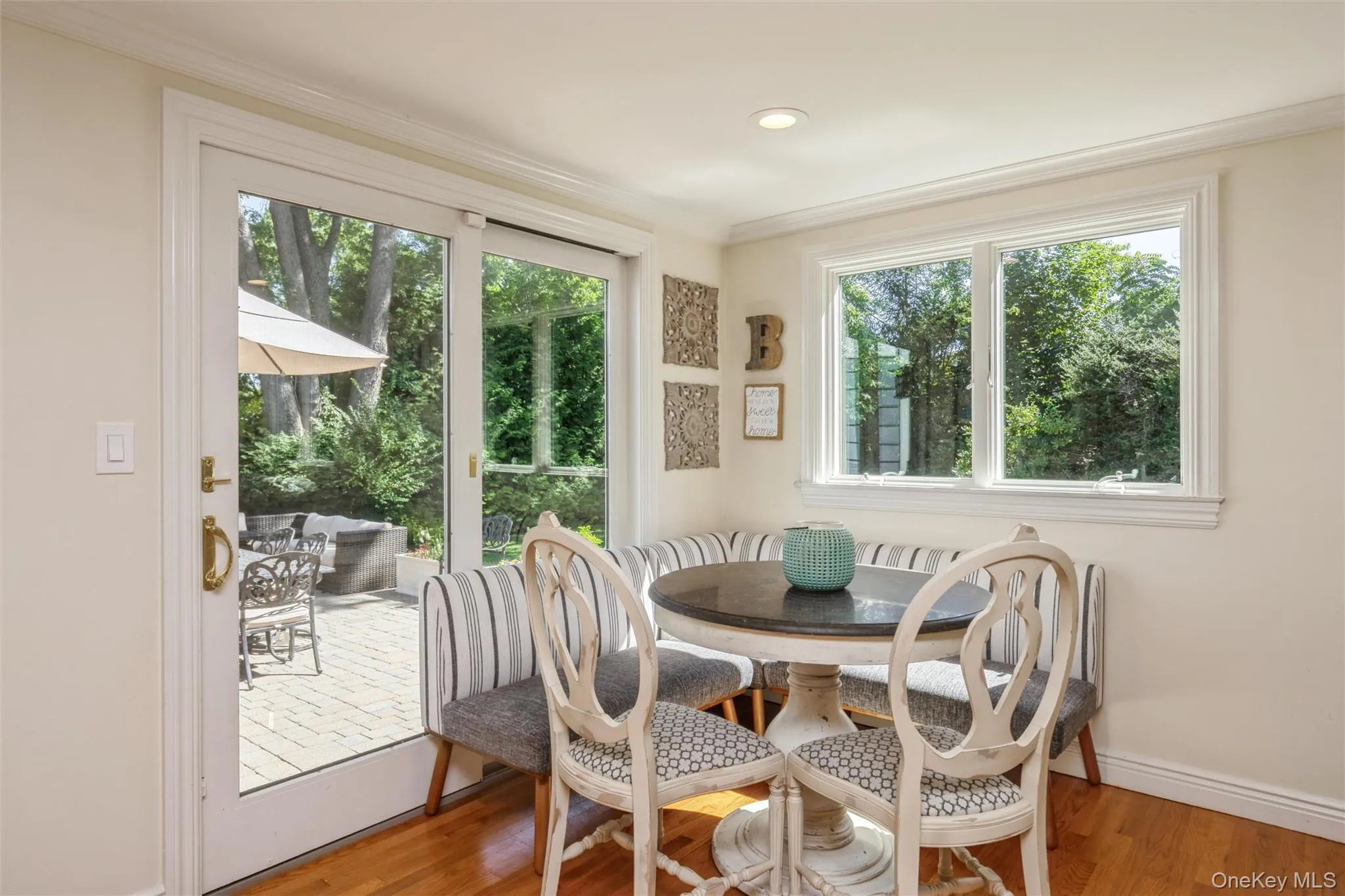 Views of the lushly landscaped property and easy access to outdoor patio create a natural indoor-outdoor connection. Views of the lushly landscaped property and easy access to outdoor patio create a natural indoor-outdoor connection.