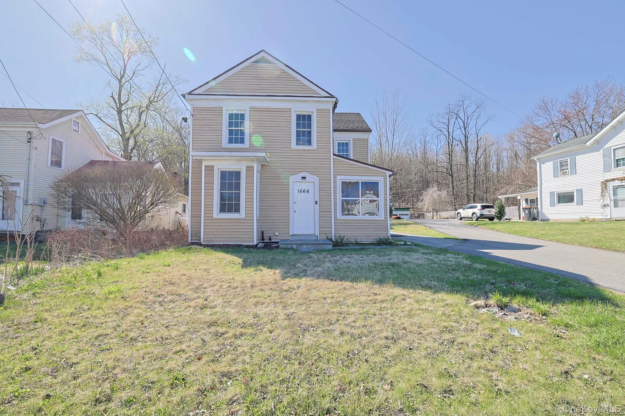 Traditional-style house with a front yard Traditional-style house with a front yard