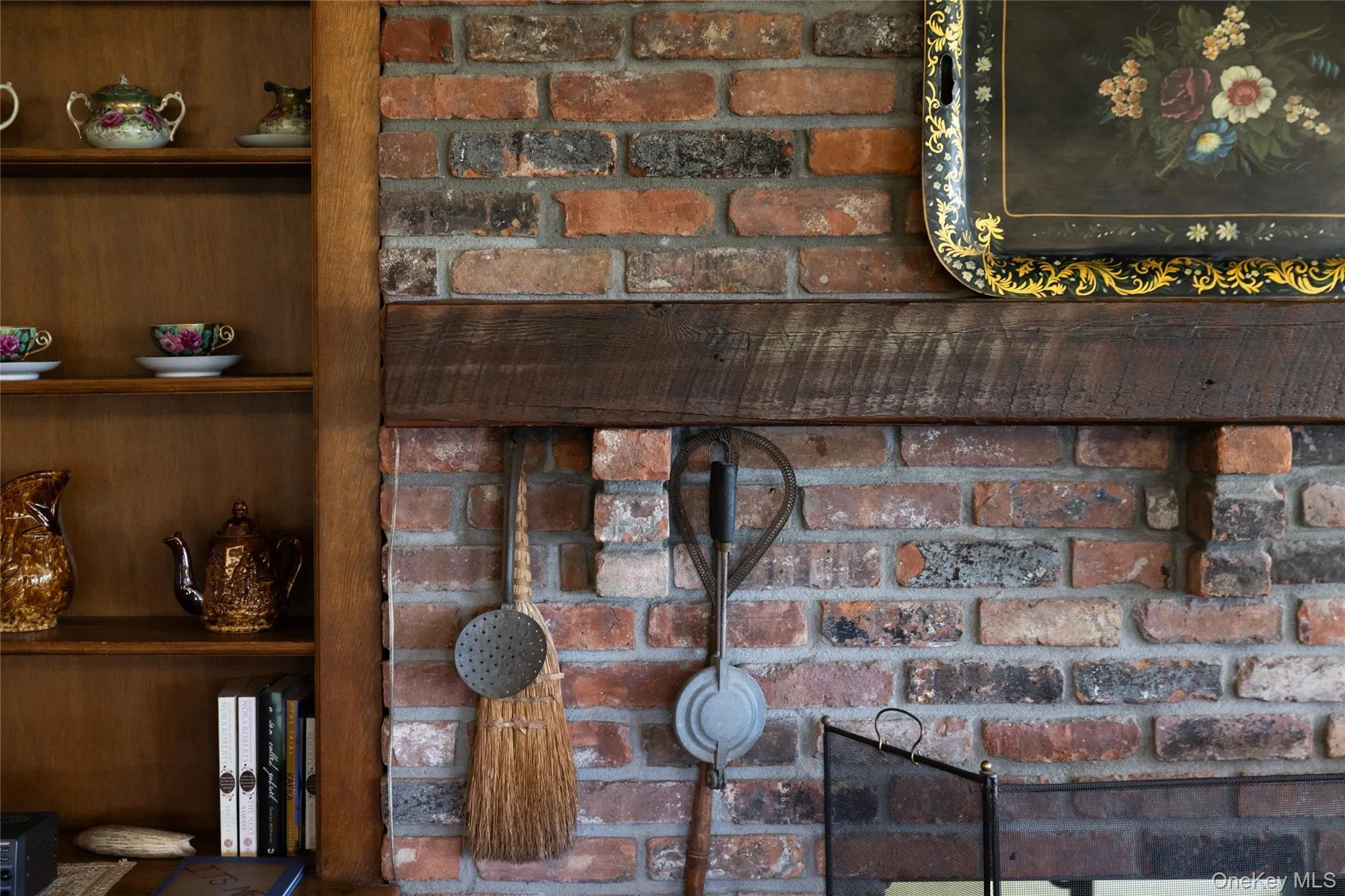 Brick fireplace surround with a distressed wood mantel Brick fireplace surround with a distressed wood mantel
