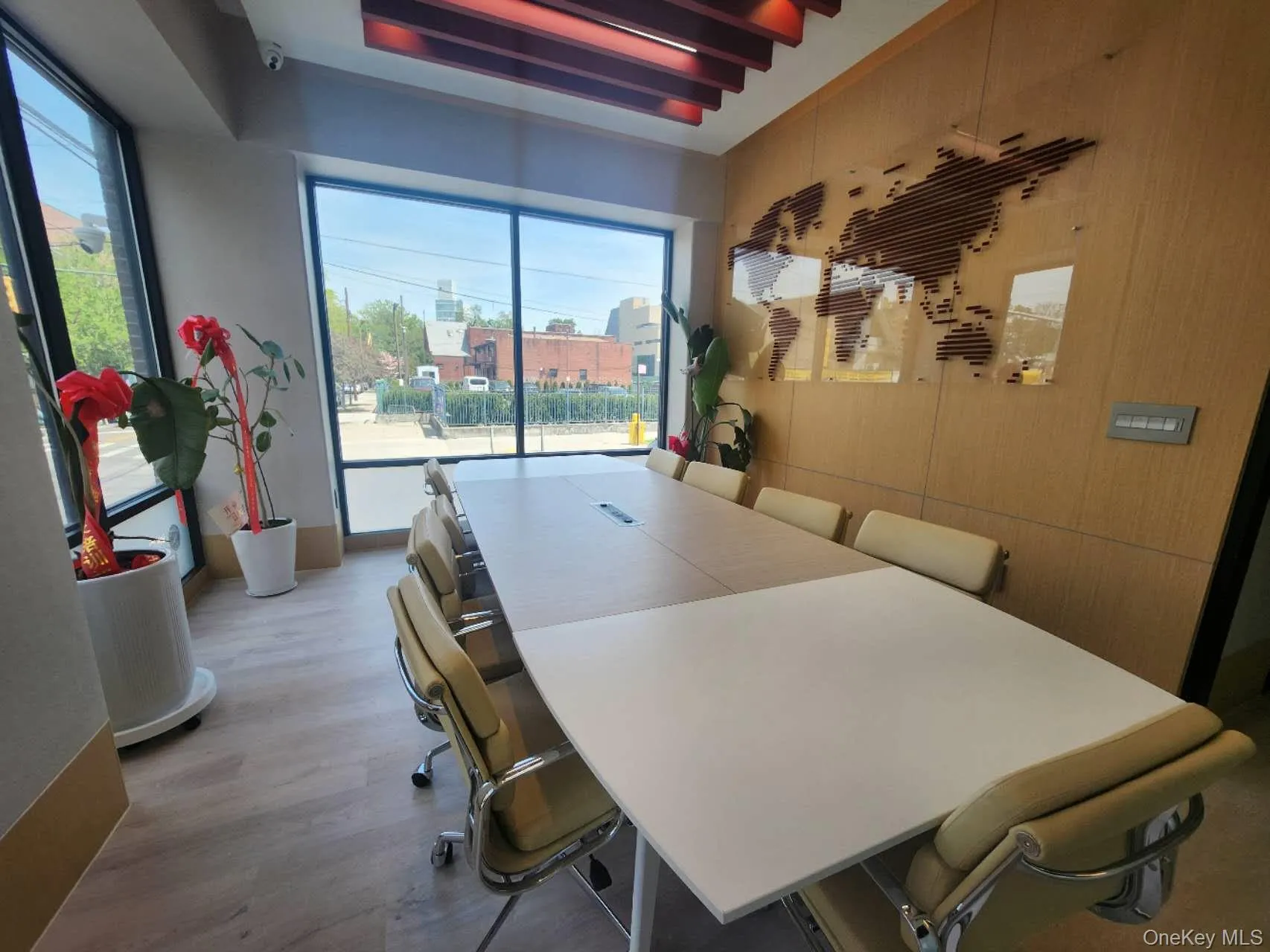 Office area with a healthy amount of sunlight, light wood-type flooring, and wooden walls Office area with a healthy amount of sunlight, light wood-type flooring, and wooden walls