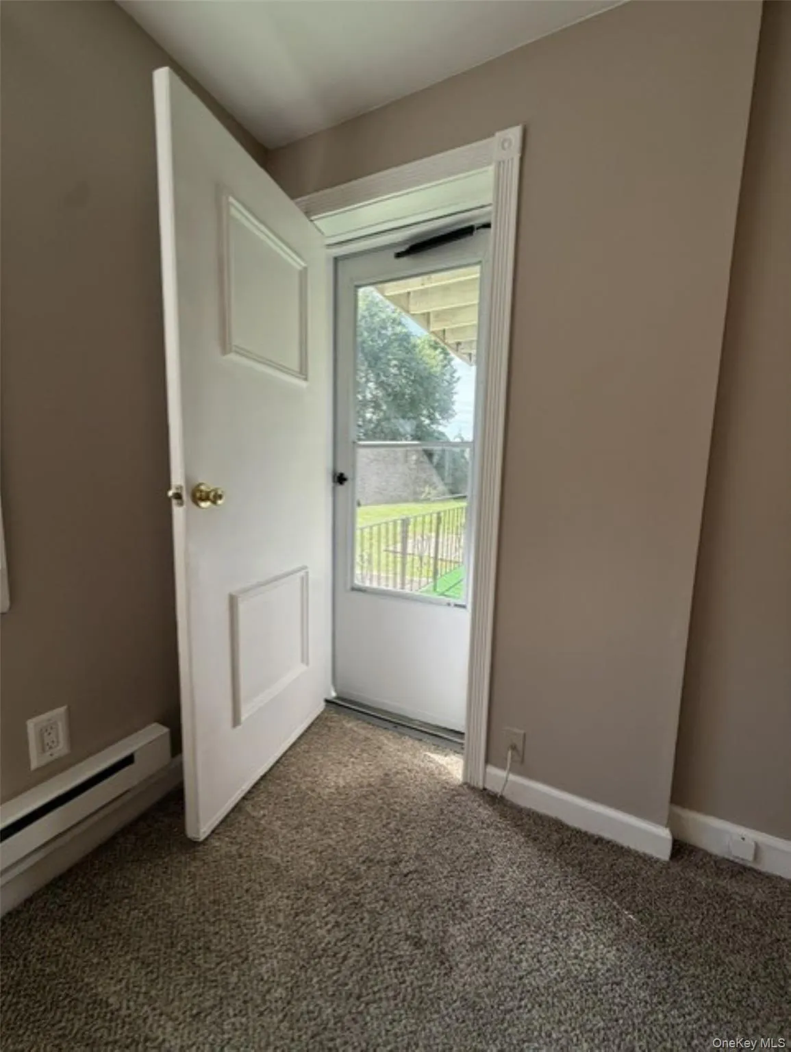 Door out to the patio & Yard from the Living Rm Door out to the patio & Yard from the Living Rm