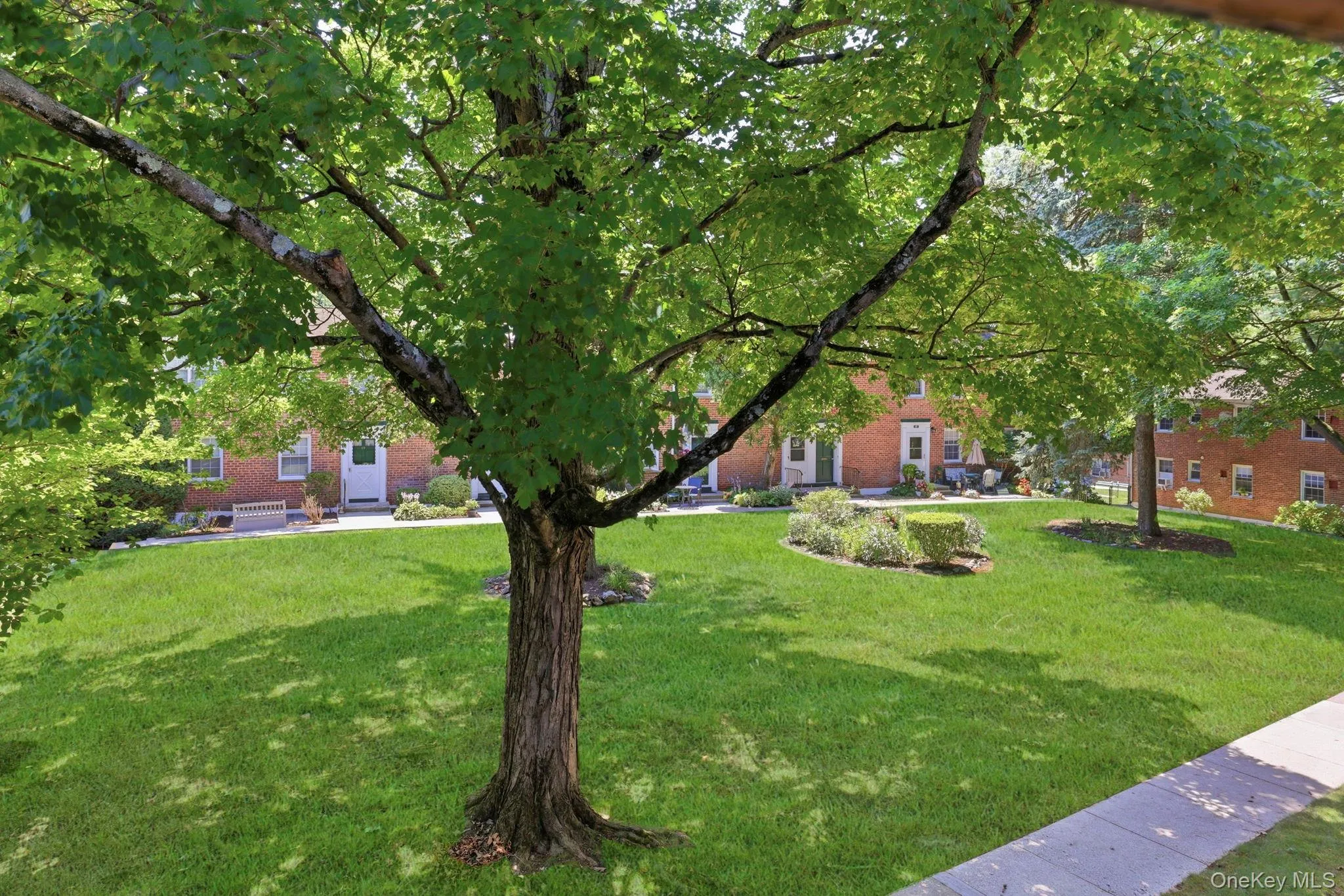 This photo was taken from a south-facing window in the apartment and shows you the view you see of the courtyard with its center garden. This photo was taken from a south-facing window in the apartment and shows you the view you see of the courtyard with its center garden.