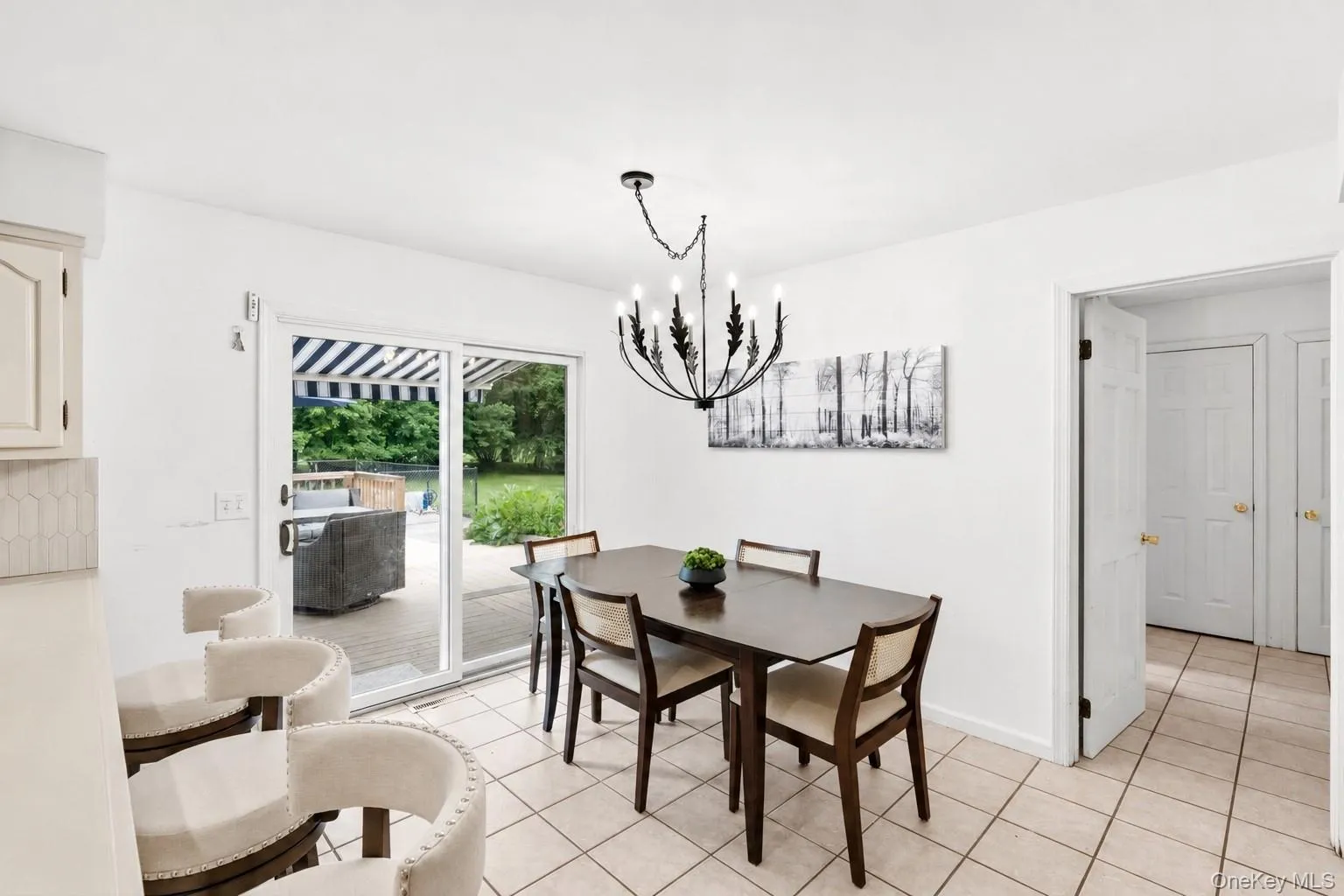 A bright and inviting perfect spot for casual dining with direct access to the deck. A bright and inviting perfect spot for casual dining with direct access to the deck.