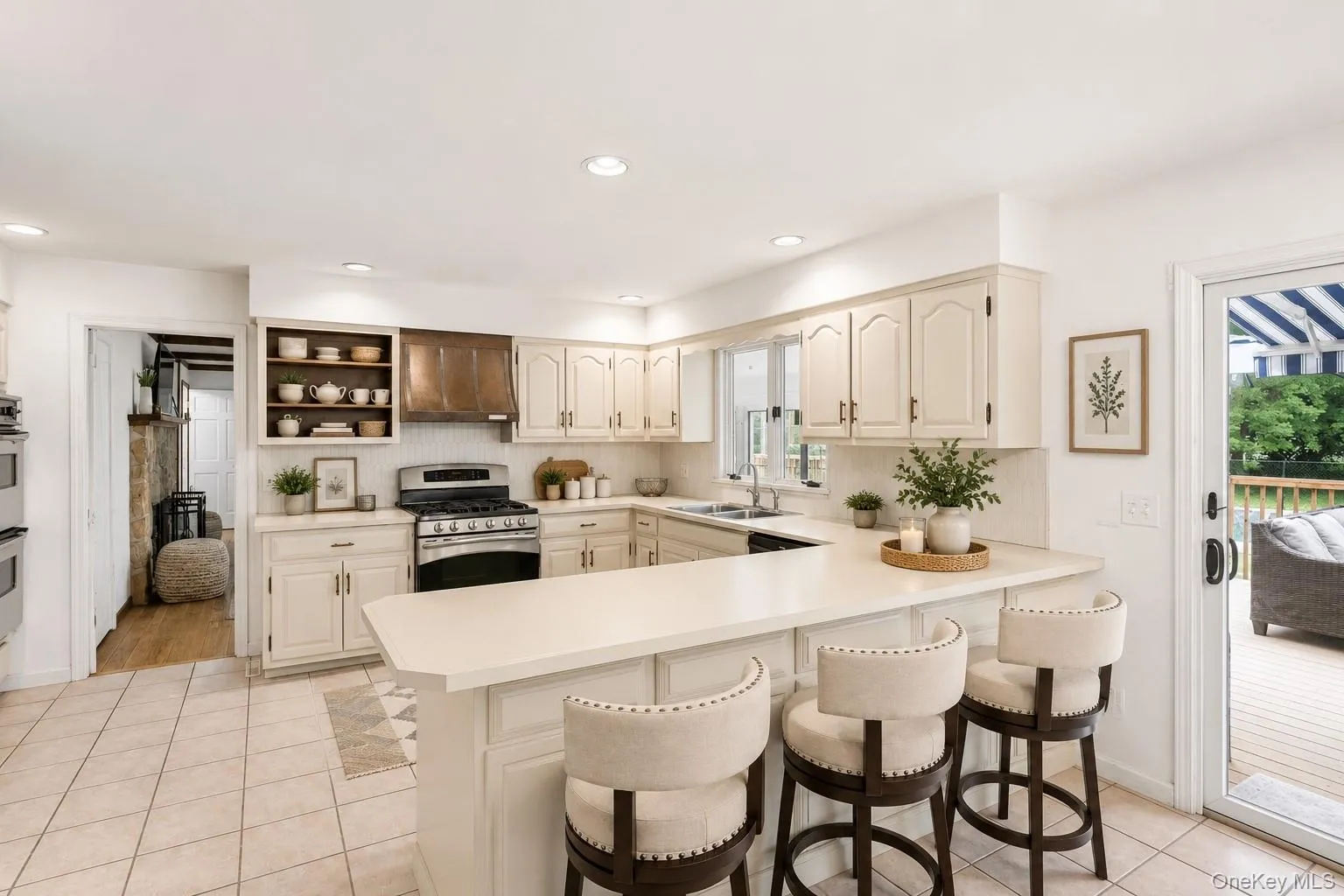 Bright and functional, the kitchen features ample cabinetry, generous workspace and an inviting open layout. Bright and functional, the kitchen features ample cabinetry, generous workspace and an inviting open layout.