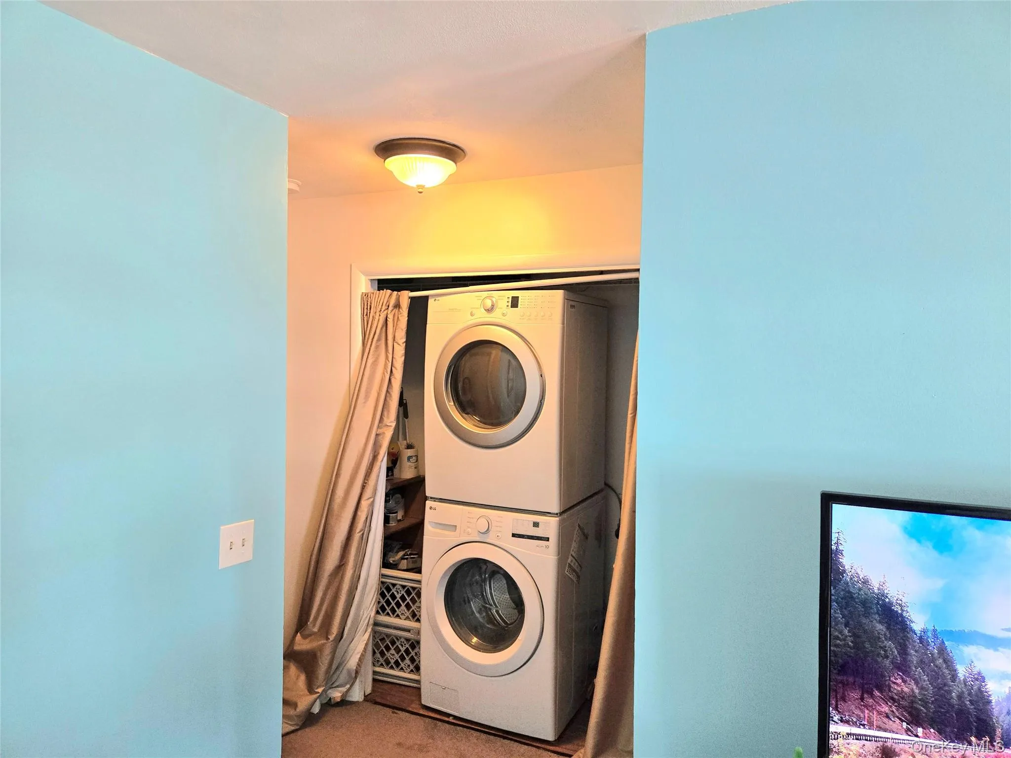 Hallway with washer/dryer. Hallway with washer/dryer.