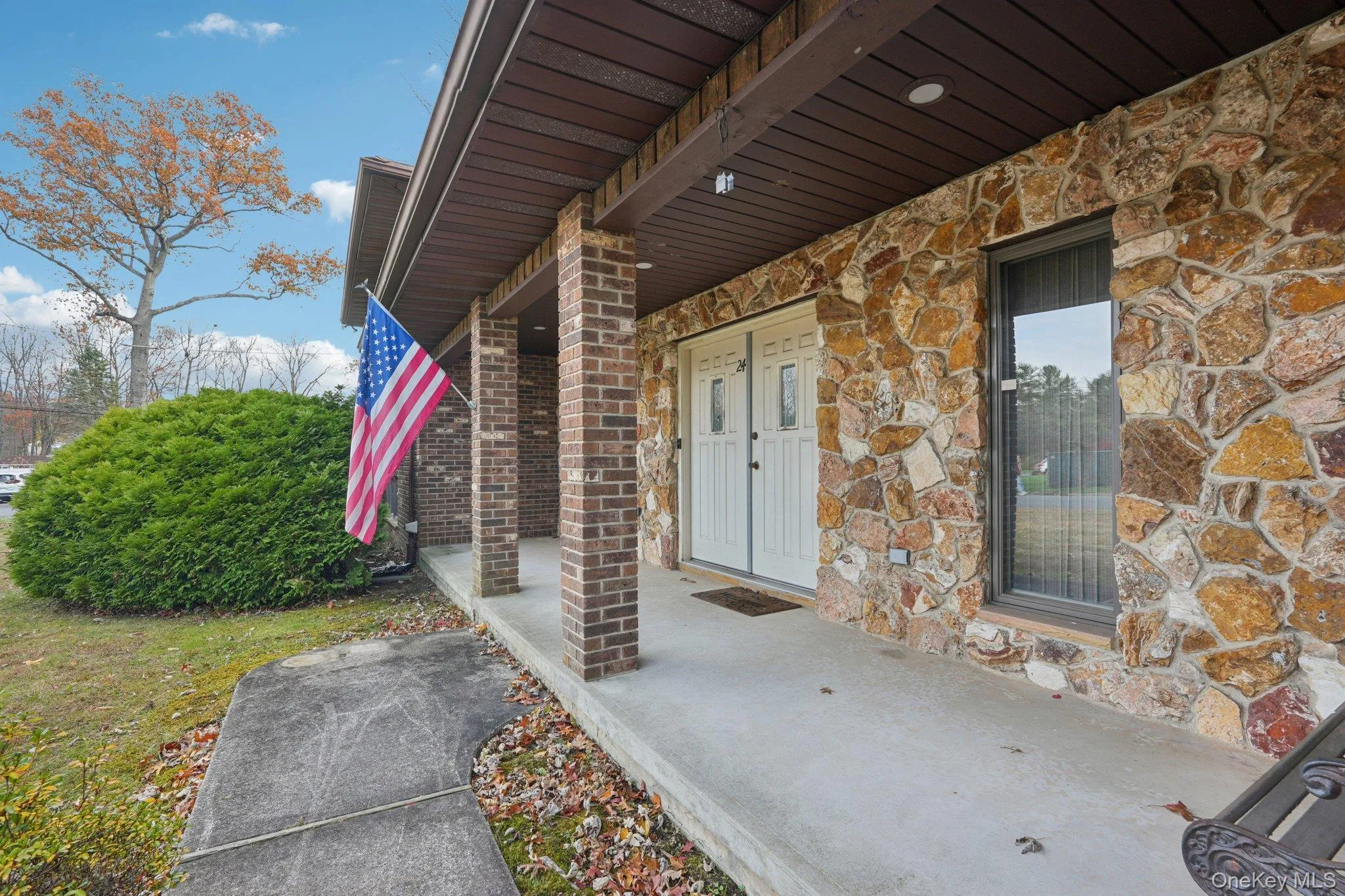 Property entrance featuring stone siding Property entrance featuring stone siding