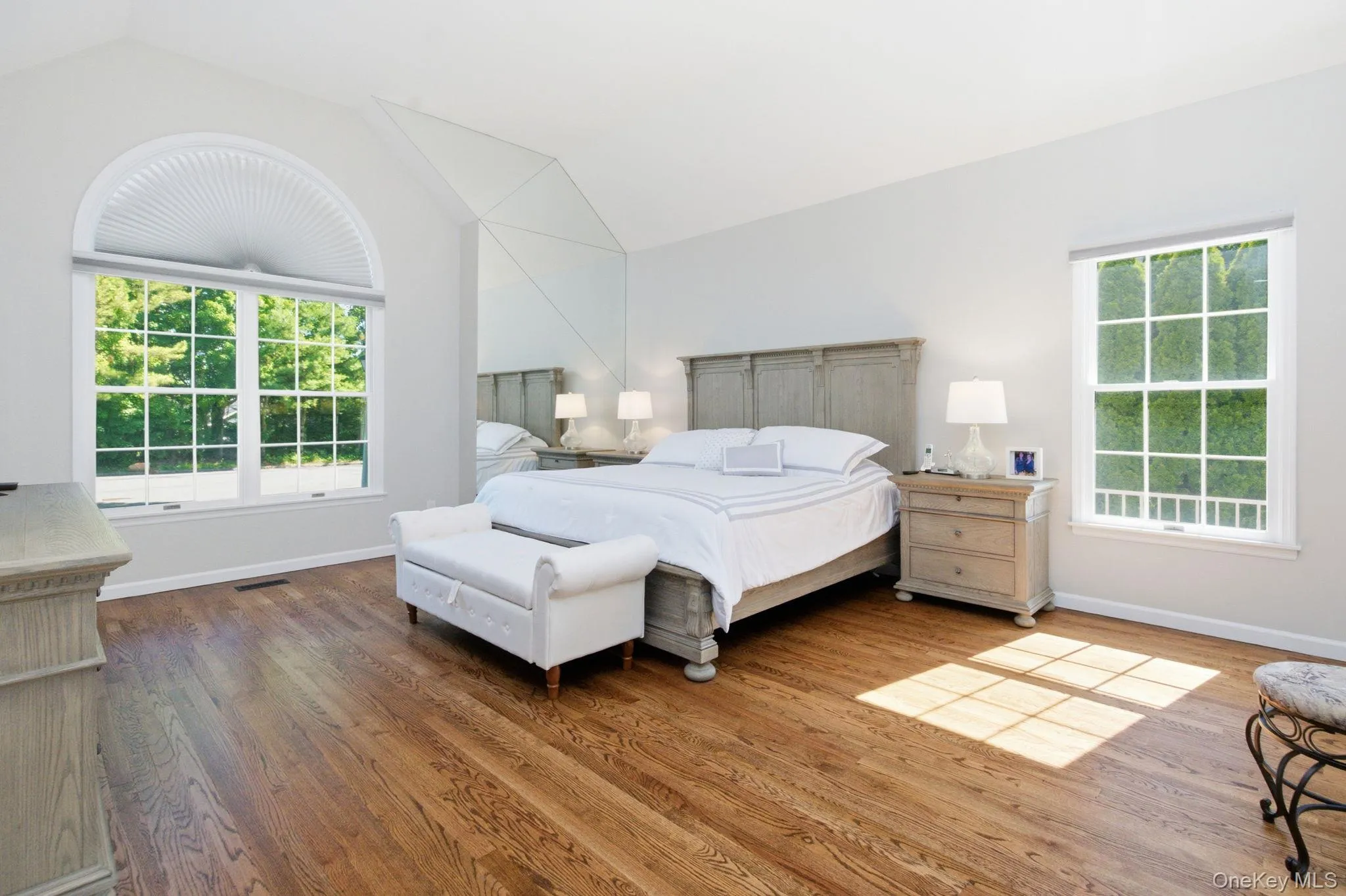 Primary Bedroom with Hardwood Floors Primary Bedroom with Hardwood Floors