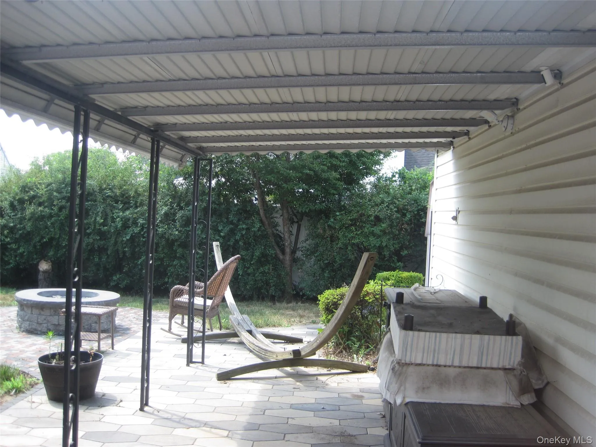 Awning Covering Patio From Sun or Rain Awning Covering Patio From Sun or Rain